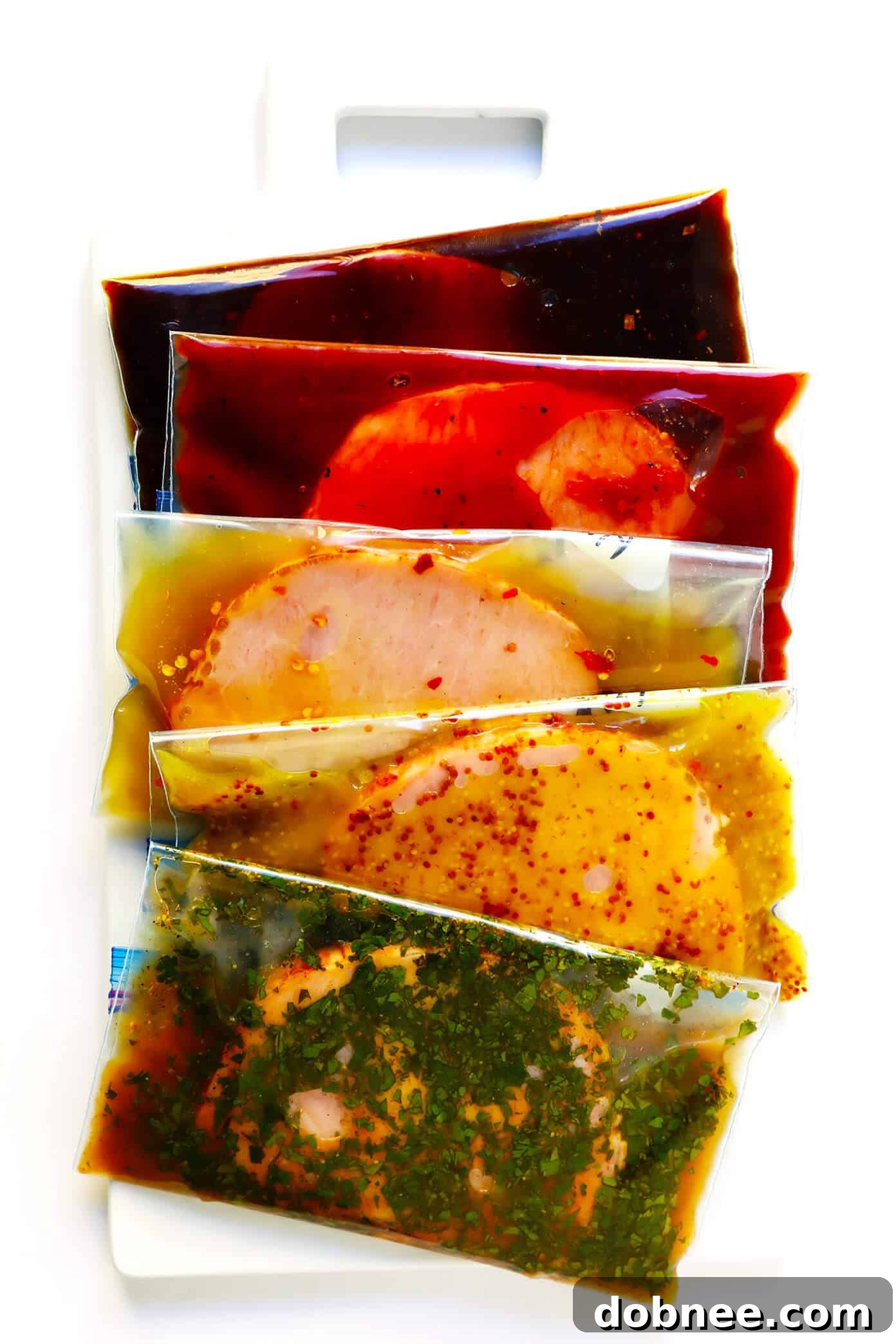 A vibrant collection of five diverse pork marinades: Moo Shu (Hoisin), BBQ, Pineapple Ginger, Maple Dijon, and Carnitas. These marinades are freezer-friendly, gluten-free, simple to prepare, and incredibly delicious, suitable for pork, steak, chicken, or tofu, and adaptable for baking, grilling, slow cooker, or Instant Pot recipes, including pulled pork. The image showcases each marinade's unique color and texture, highlighting fresh ingredients.