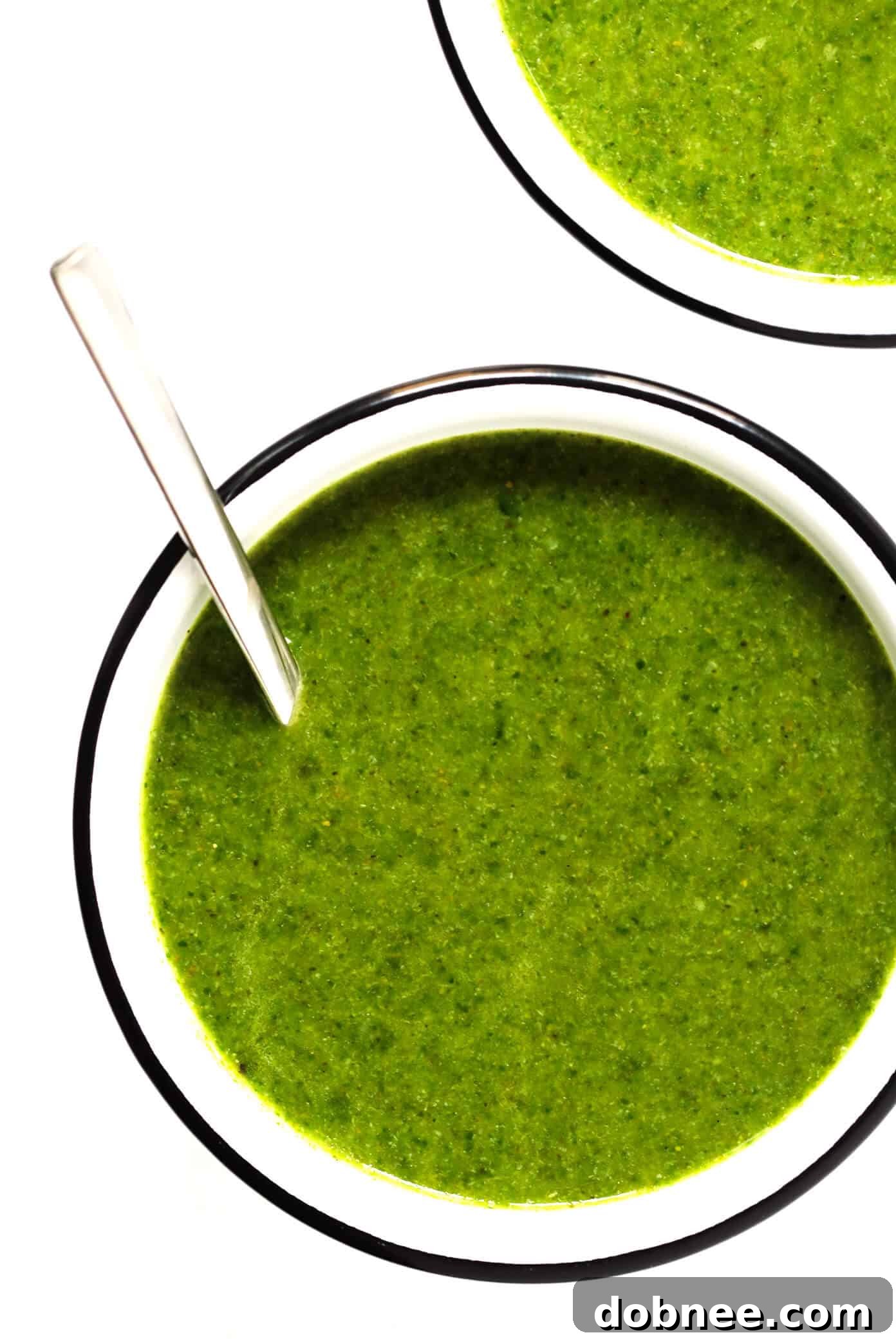 Serving of Green Goddess Soup topped with avocado and cilantro