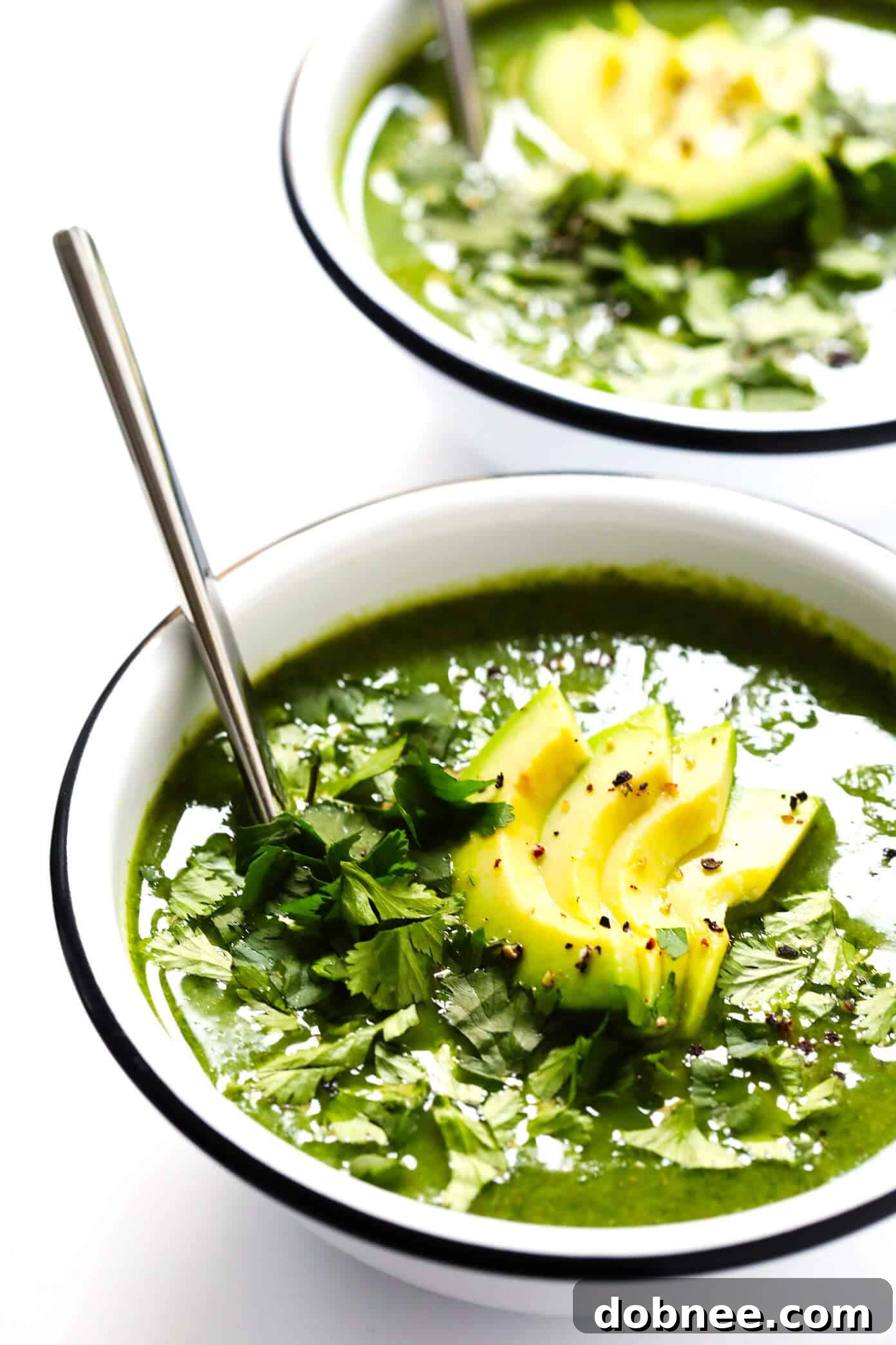 Overhead shot of Green Goddess Soup in a bowl with toppings