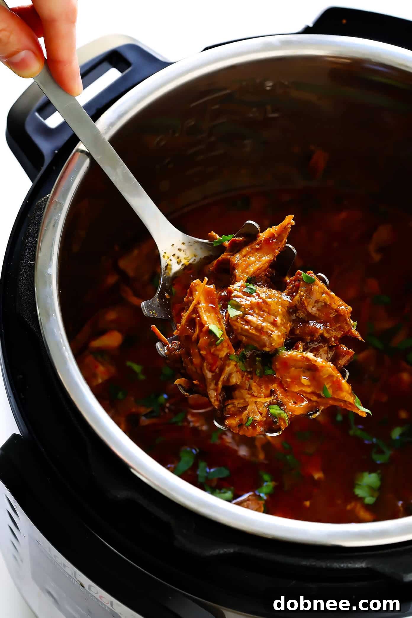 Discover this amazing Instant Pot Barbacoa Beef recipe – easy, flavorful, and incredibly versatile for all your Mexican food cravings. Close-up of shredded Instant Pot Barbacoa Beef, ready for serving