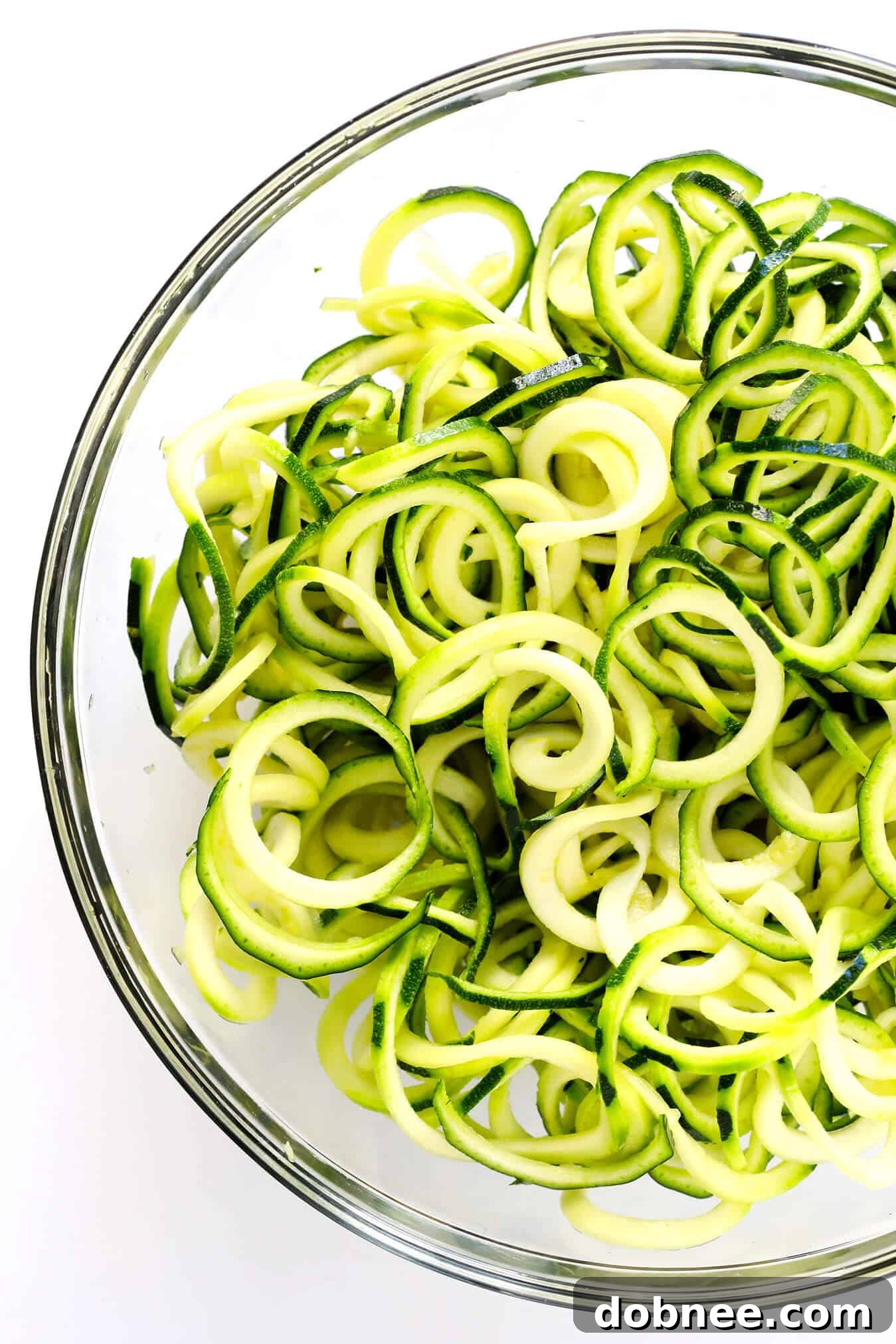Freshly spiralized zucchini noodles (zoodles) ready for cooking