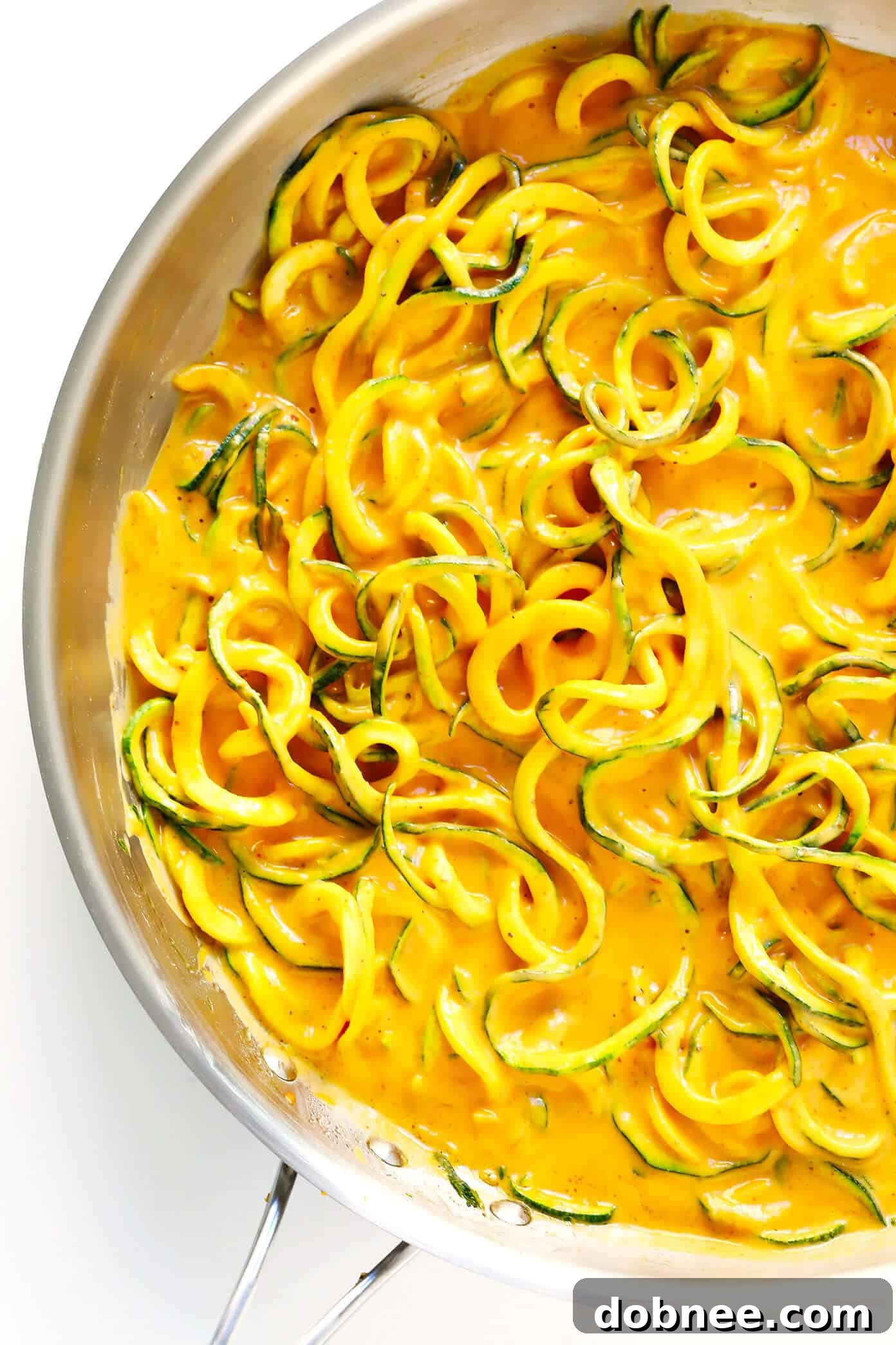 Sautéed Zucchini Noodles coated in rich Red Curry Satay Sauce