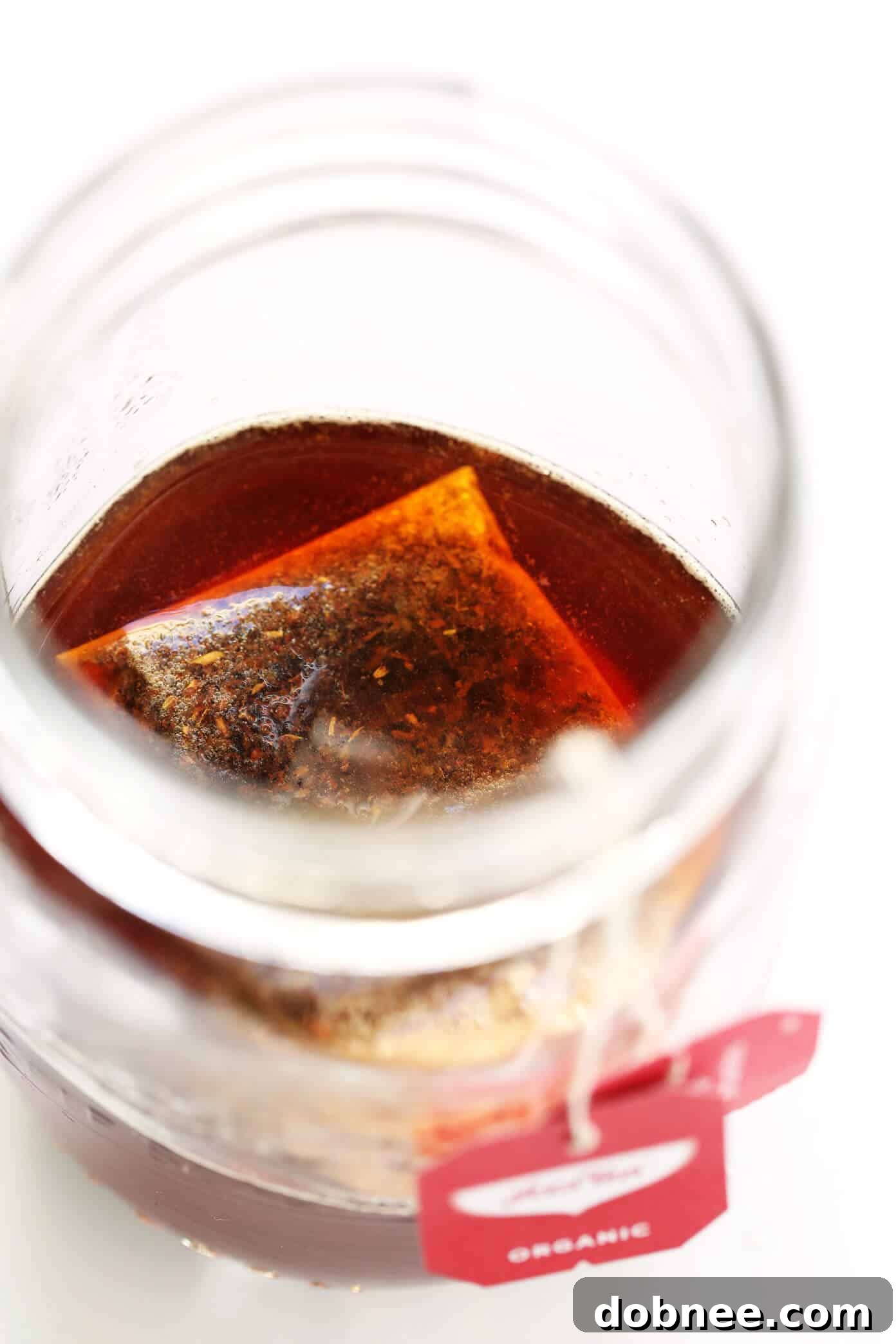 Simple ingredients for an Iced Rooibos Latte arranged on a wooden kitchen surface