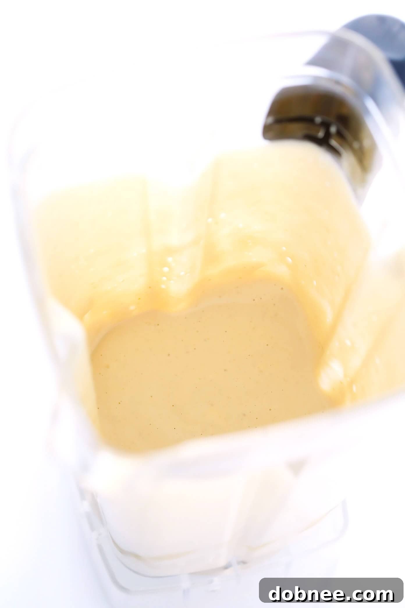 Blender Tahini Dip: Your Go-To Healthy Appetizer Blender Tahini Dip in a sleek white bowl, ready to be served.