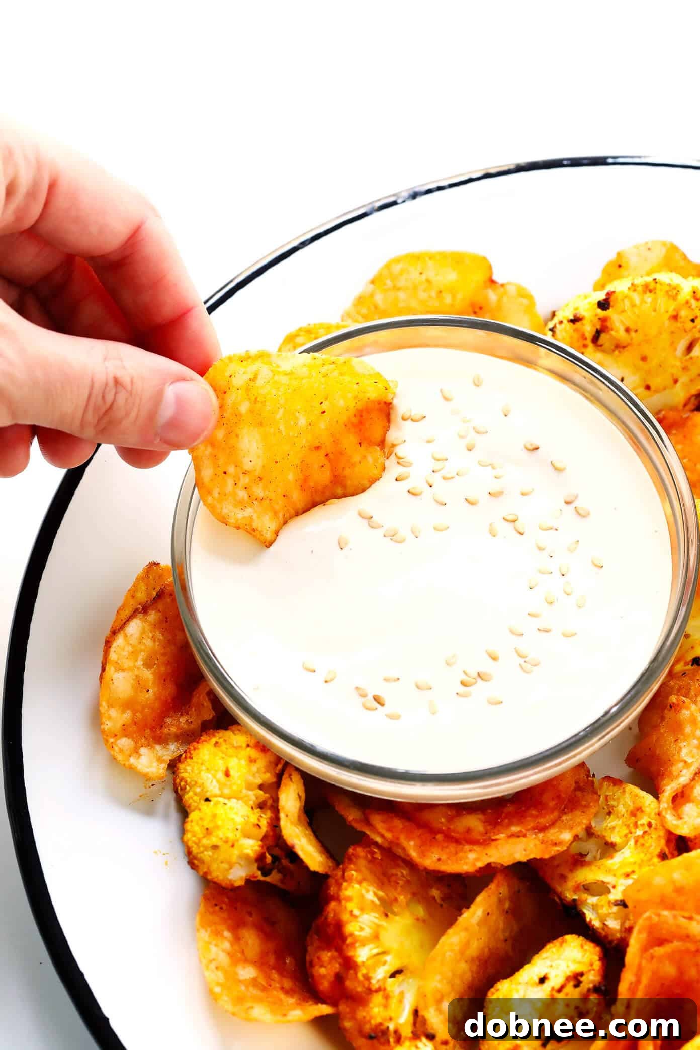 Irresistible 5-Minute Tahini Dip: A Feast for the Senses 5-Minute Dreamy Tahini Dip served with roasted cauliflower and Kettle Chips.