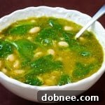 White Bean, Spinach & Pesto Soup in a rustic bowl