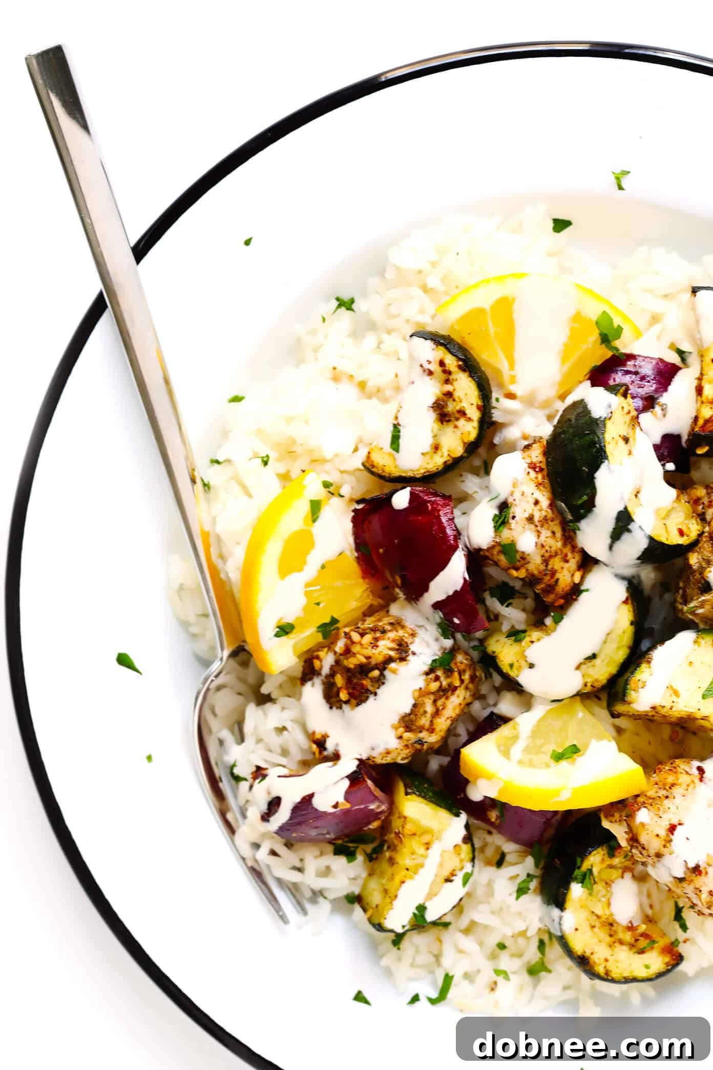 Za'atar Chicken and Vegetable Kabobs over rice with tahini dressing