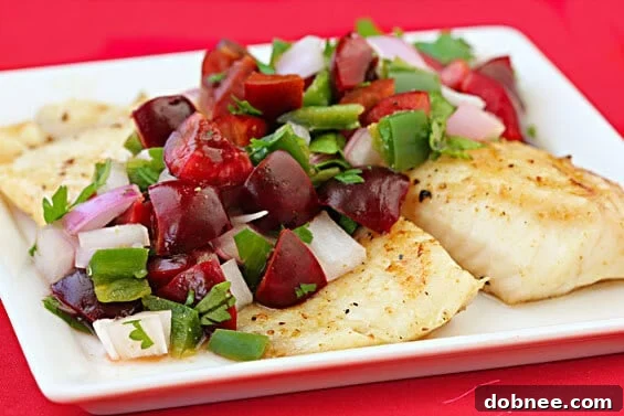 Grilled Tilapia with Cherry Salsa on a white plate