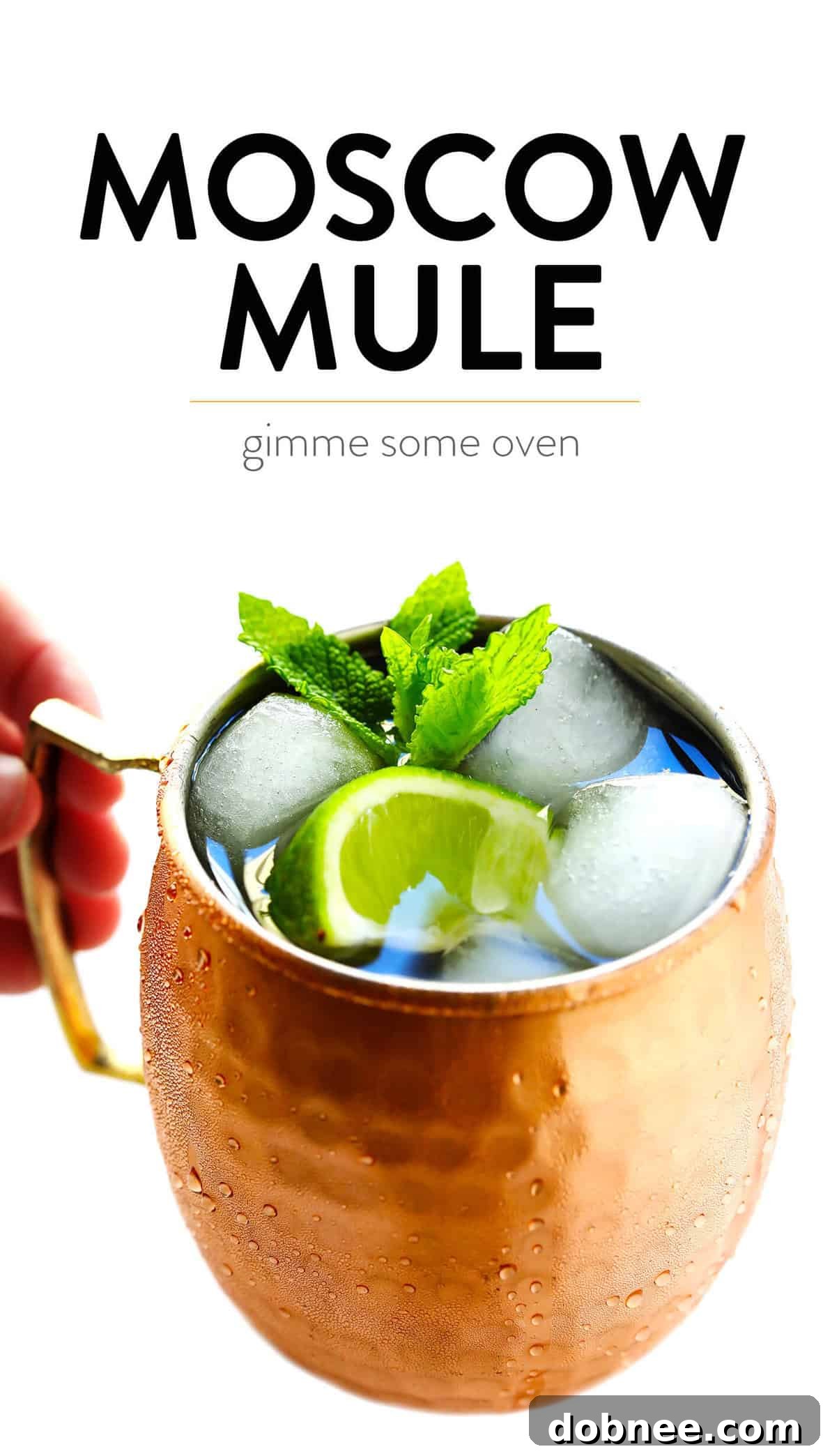 A refreshing Moscow Mule cocktail served in a classic copper mug, garnished with lime and mint.