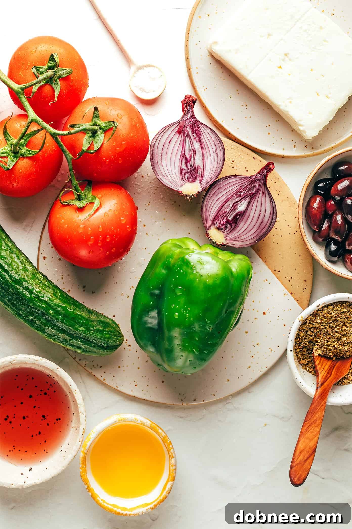 Close-up of fresh Greek Salad ingredients including cucumber, tomato, and red onion