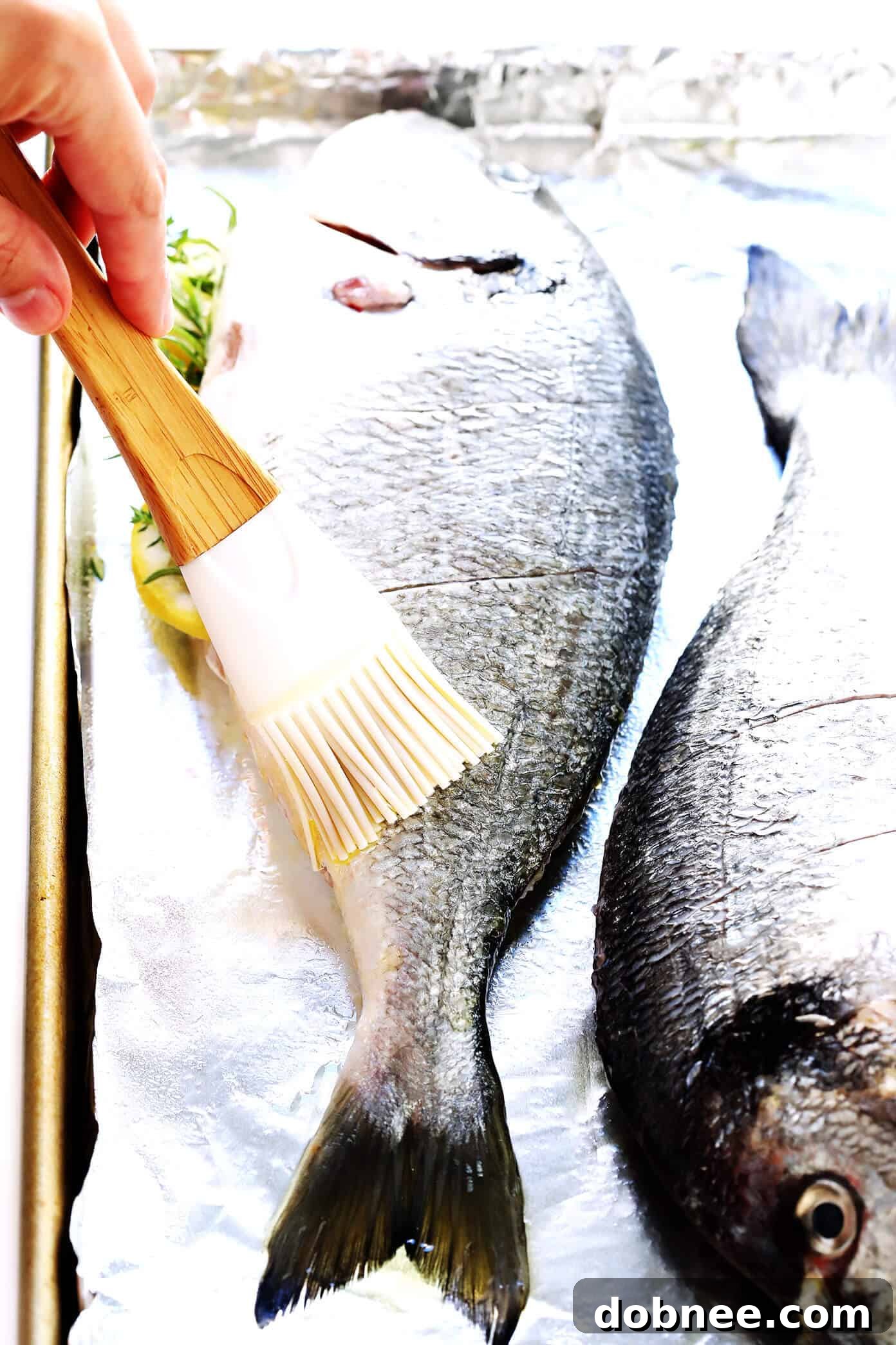 Learn to make a simple baked whole fish in the oven with minimal ingredients and maximum flavor. A healthy and delicious dinner idea. Simple Baked Fish Recipe for Whole Fish