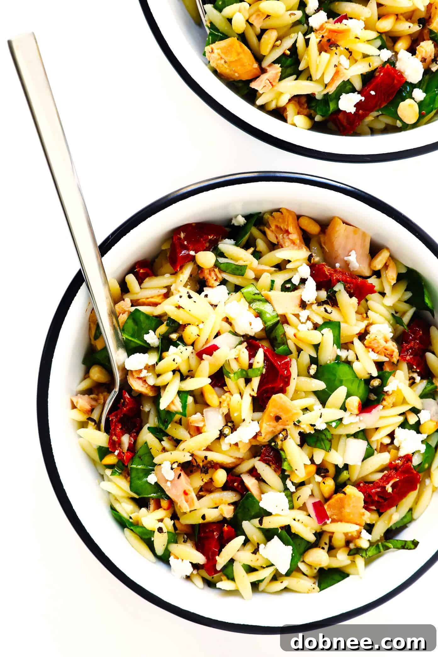 Final presentation of the Italian Orzo Tuna Salad, showcasing its vibrant ingredients and inviting texture, ready to be enjoyed.