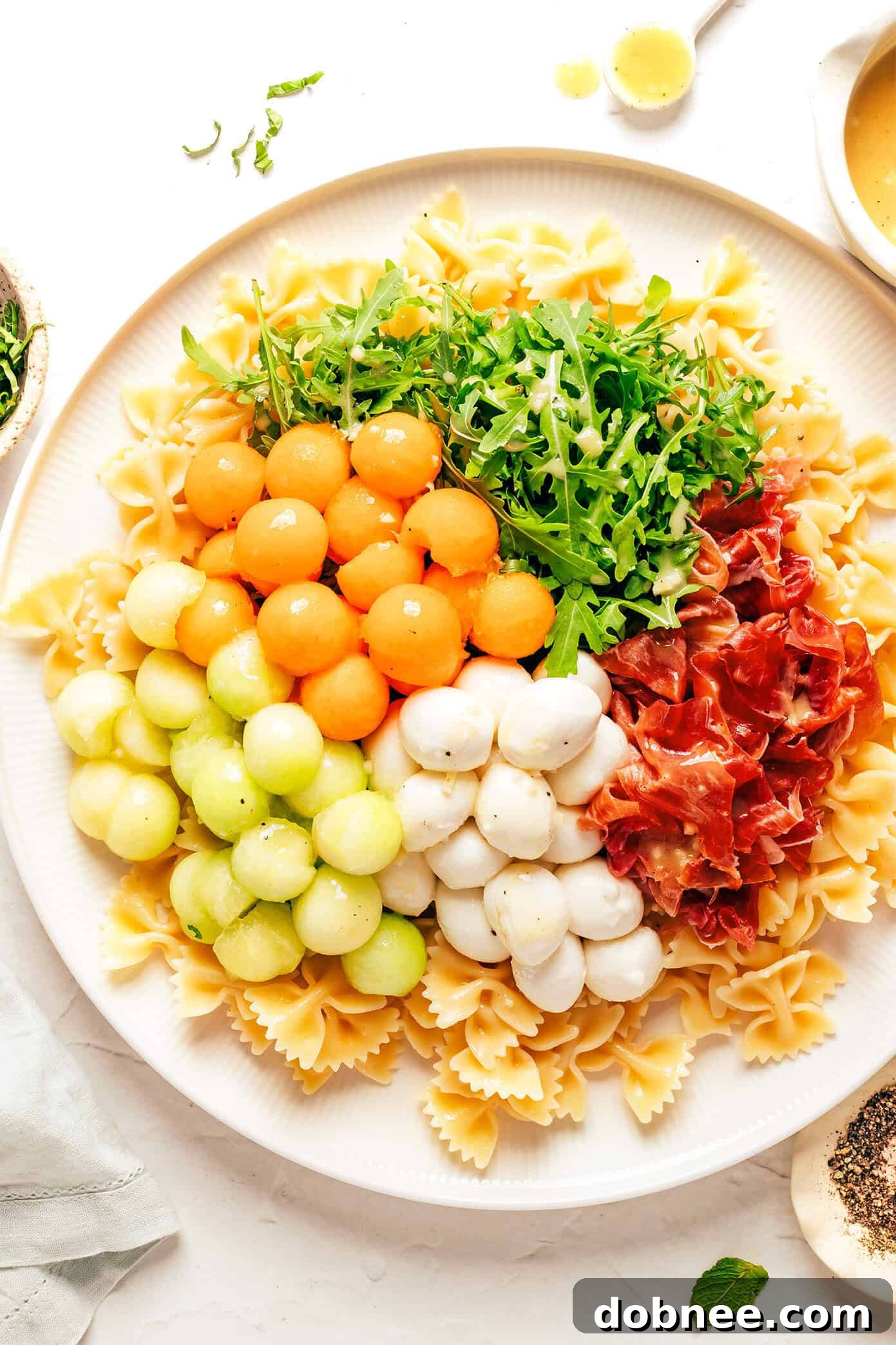 Melon Prosciutto Pasta Delight 4 Overhead shot of Prosciutto Melon Pasta Salad, emphasizing the fresh ingredients and the light dressing.