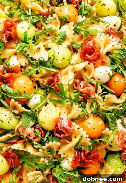Prosciutto Melon Pasta Salad with a light vinaigrette.