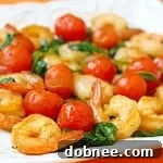 Thumbnail image of sautéed shrimp with spinach and tomatoes.
