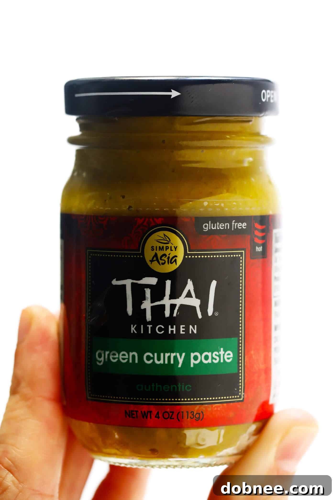 Close-up of vibrant green curry paste in a bowl, highlighting the essential ingredient for an authentic Thai green curry soup