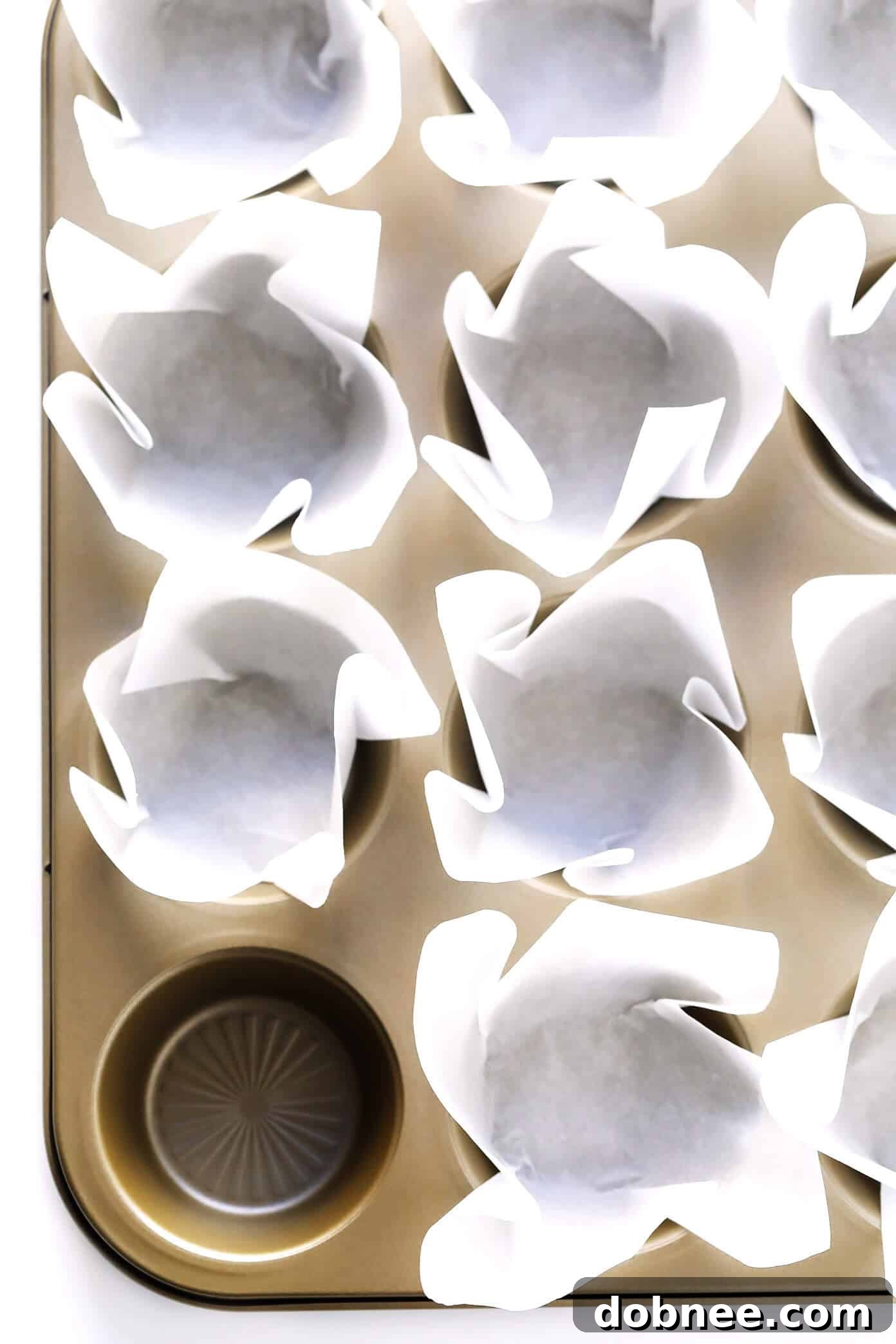 How To Make Cupcake Liners With Parchment Paper: A detailed guide to folding parchment paper into elegant baking cups.