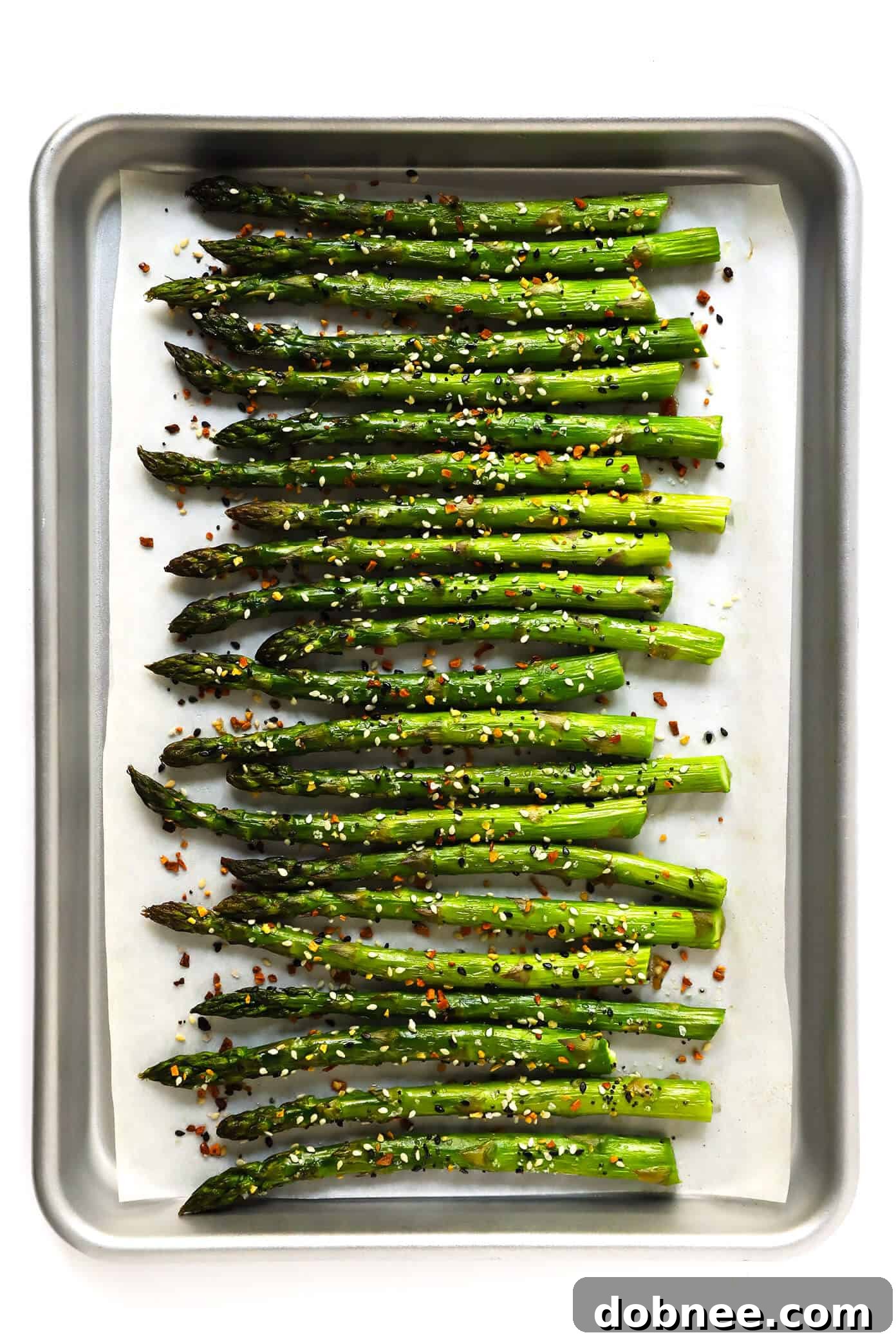 Kick your roasted asparagus recipe up a notch this season with some everything bagel seasoning! It's super quick and easy to make, naturally vegan and gluten-free, and makes the most delicious healthy side dish. Plated "Everything" Roasted Asparagus, ready to be served.
