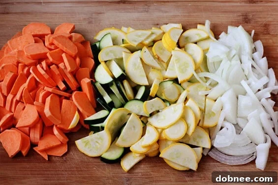 A close-up shot of the finished Sweet Potato & Zucchini Hash, topped with a runny sunny-side-up egg and fresh herbs, ready to be enjoyed.