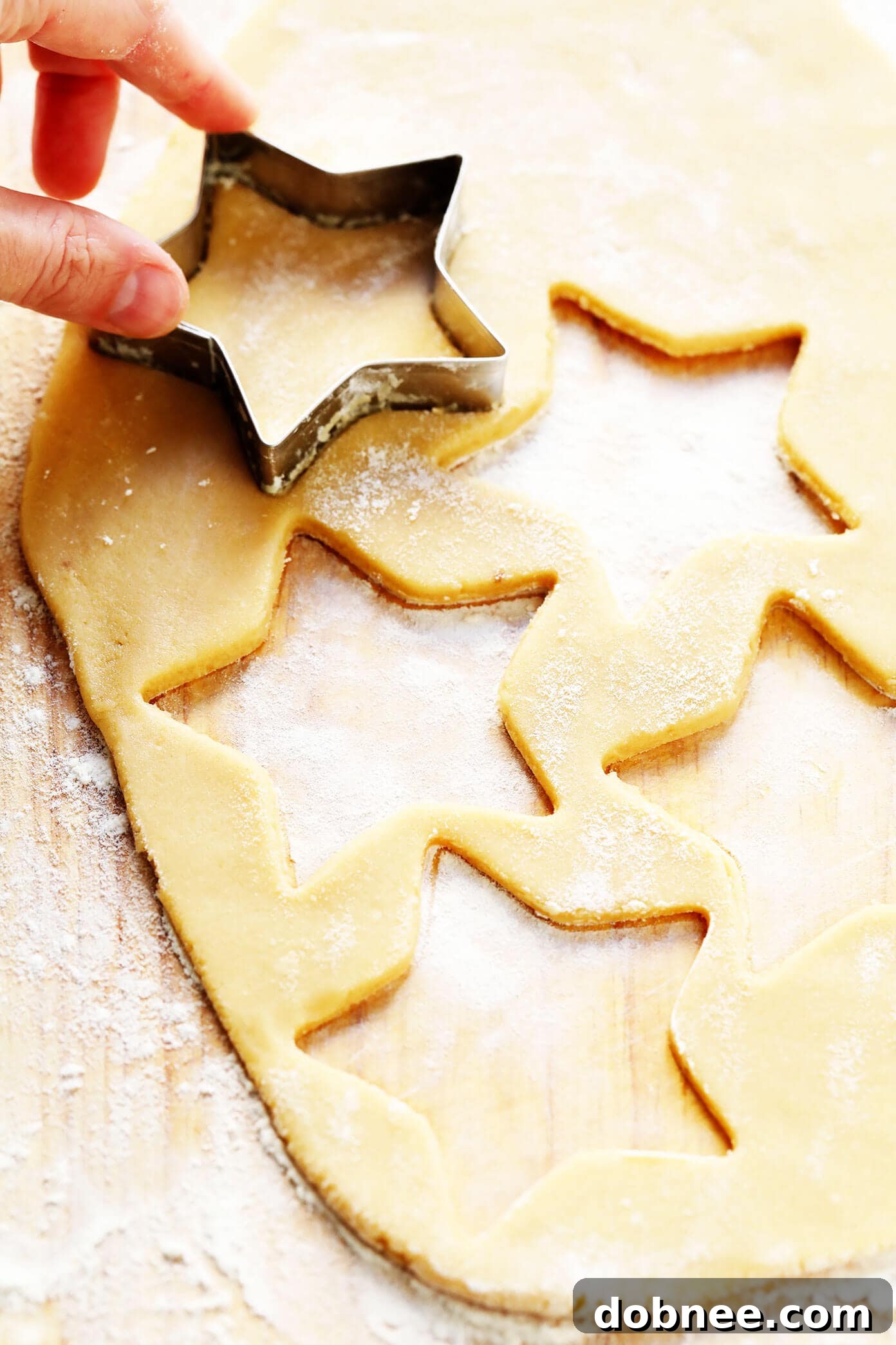 Beautifully cut-out Brown Sugar Cookies, showcasing perfect shape retention, ready for baking and decorating.