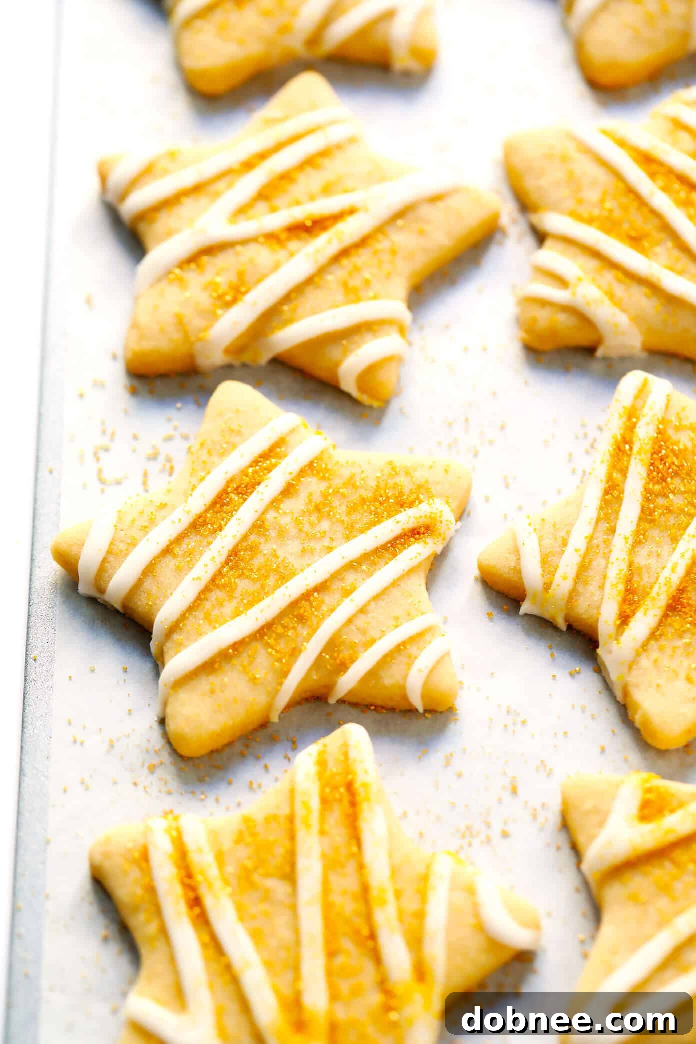 Step-by-step guide on how to make perfect cut-out sugar cookies, showing the dough being rolled and cut.