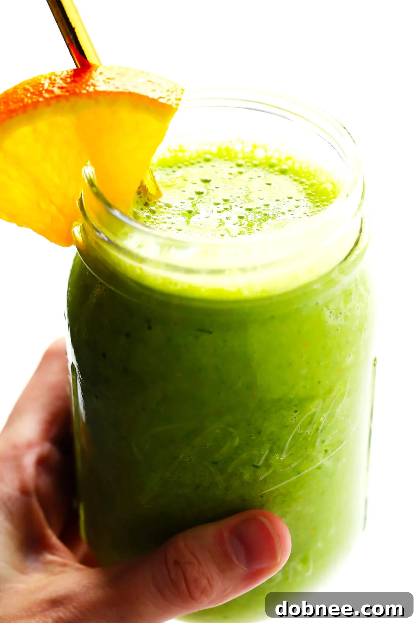 Green Orange Julius Recipe - Refreshing healthy smoothie in a glass with a straw.