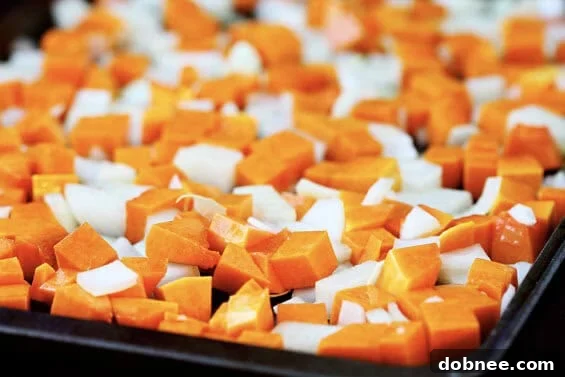 Close-up of Roasted Butternut and Bacon Pasta with sage garnish.