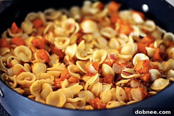 A dish of Roasted Butternut and Bacon Pasta, ready to be served.