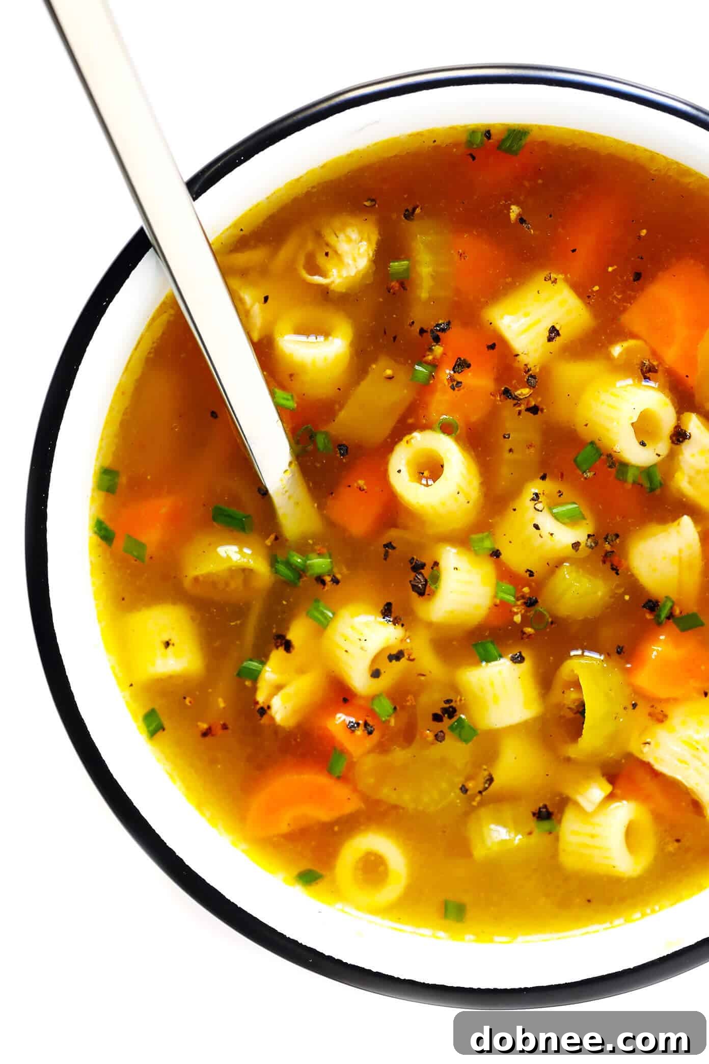 Close-up of a steaming bowl of Pepperoncini Chicken Noodle Soup