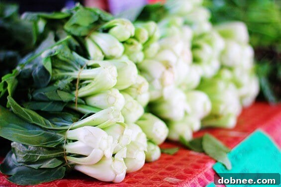 Fresh baby bok choy ready for cooking, a key ingredient for a healthy meal.