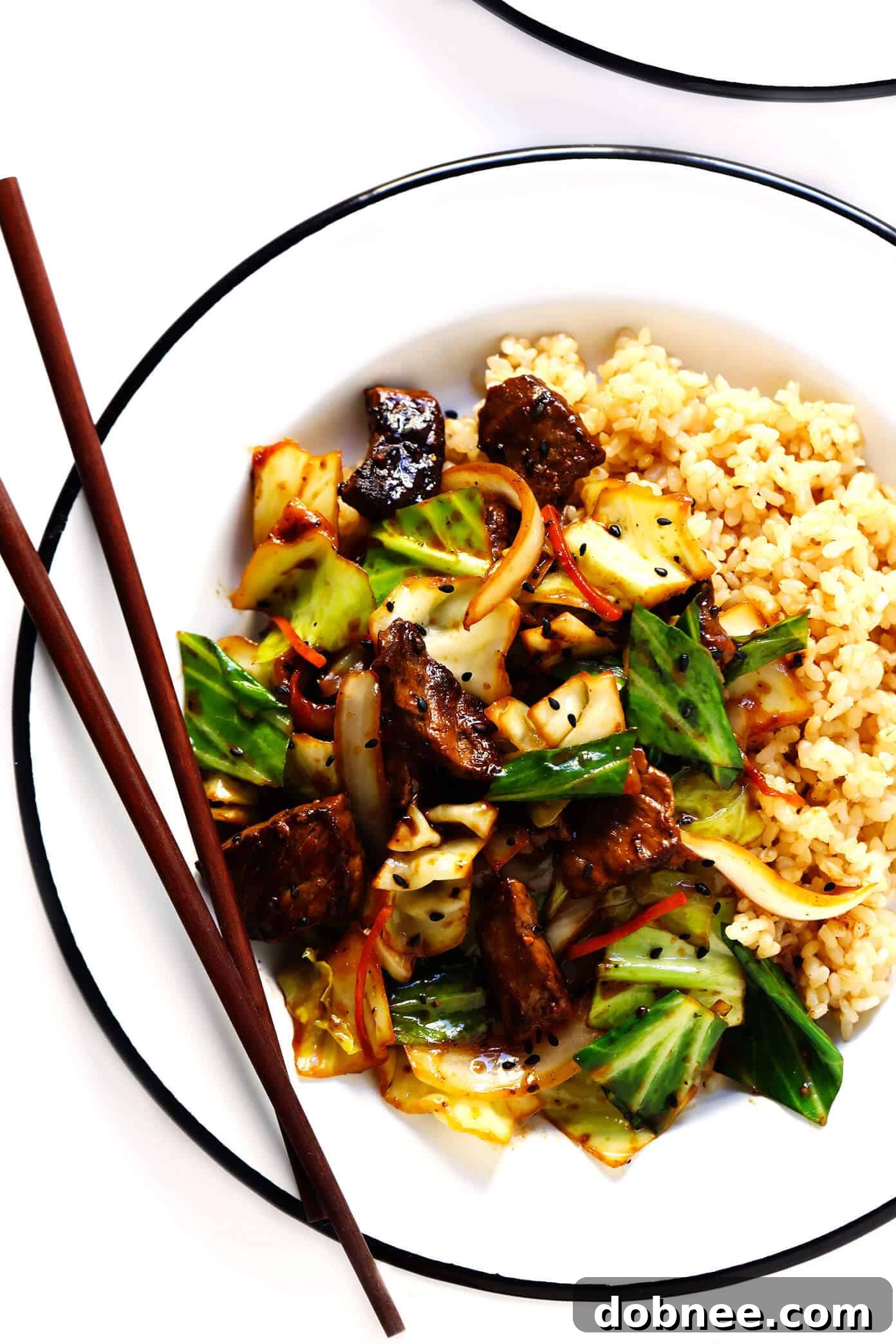 Ginger Beef and Cabbage Stir-Fry with brown rice, ready to eat