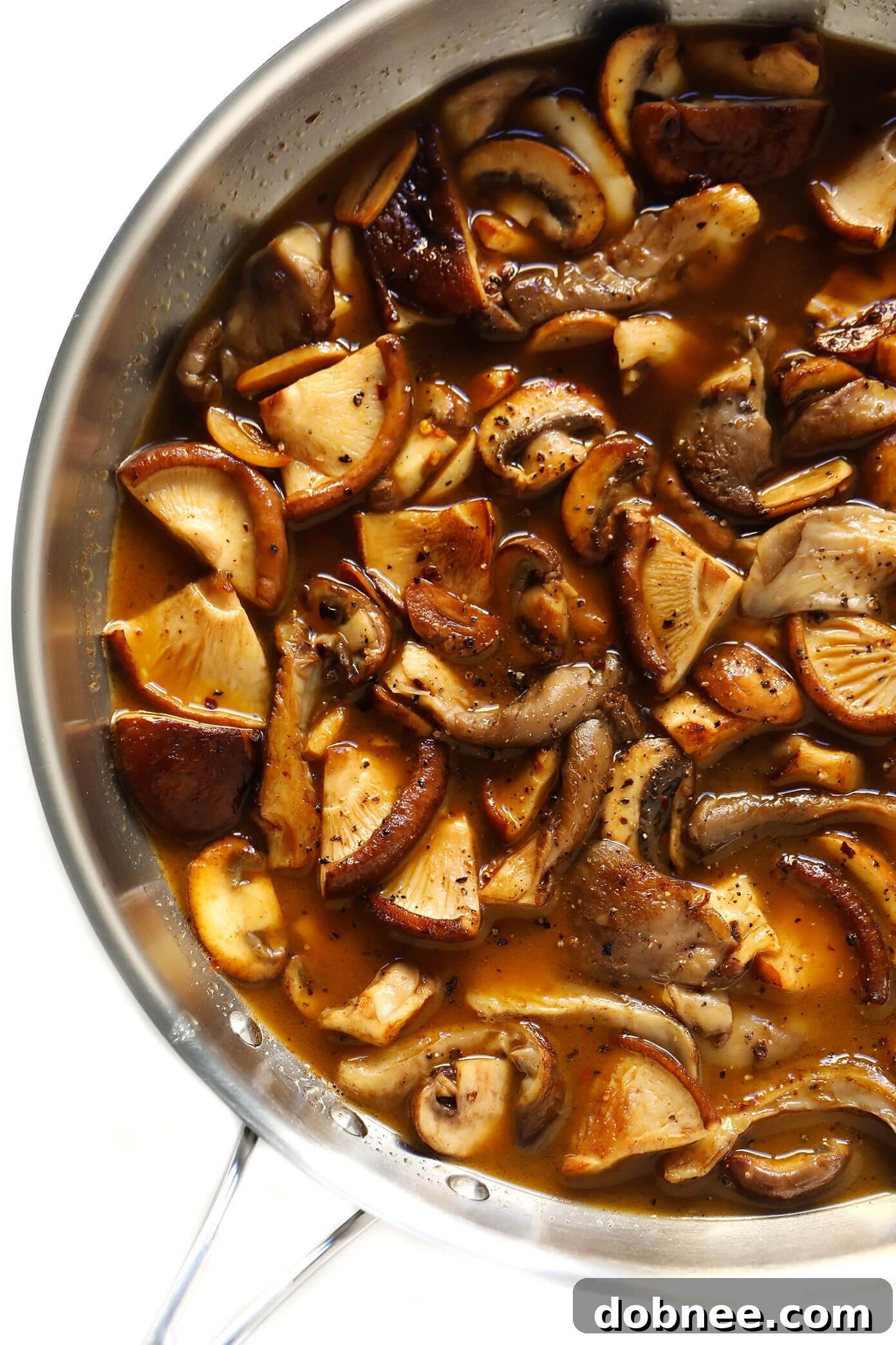 Aromatic White Wine Balsamic Mushroom Sauce Close-up of the rich white wine balsamic mushroom sauce simmering in a pan