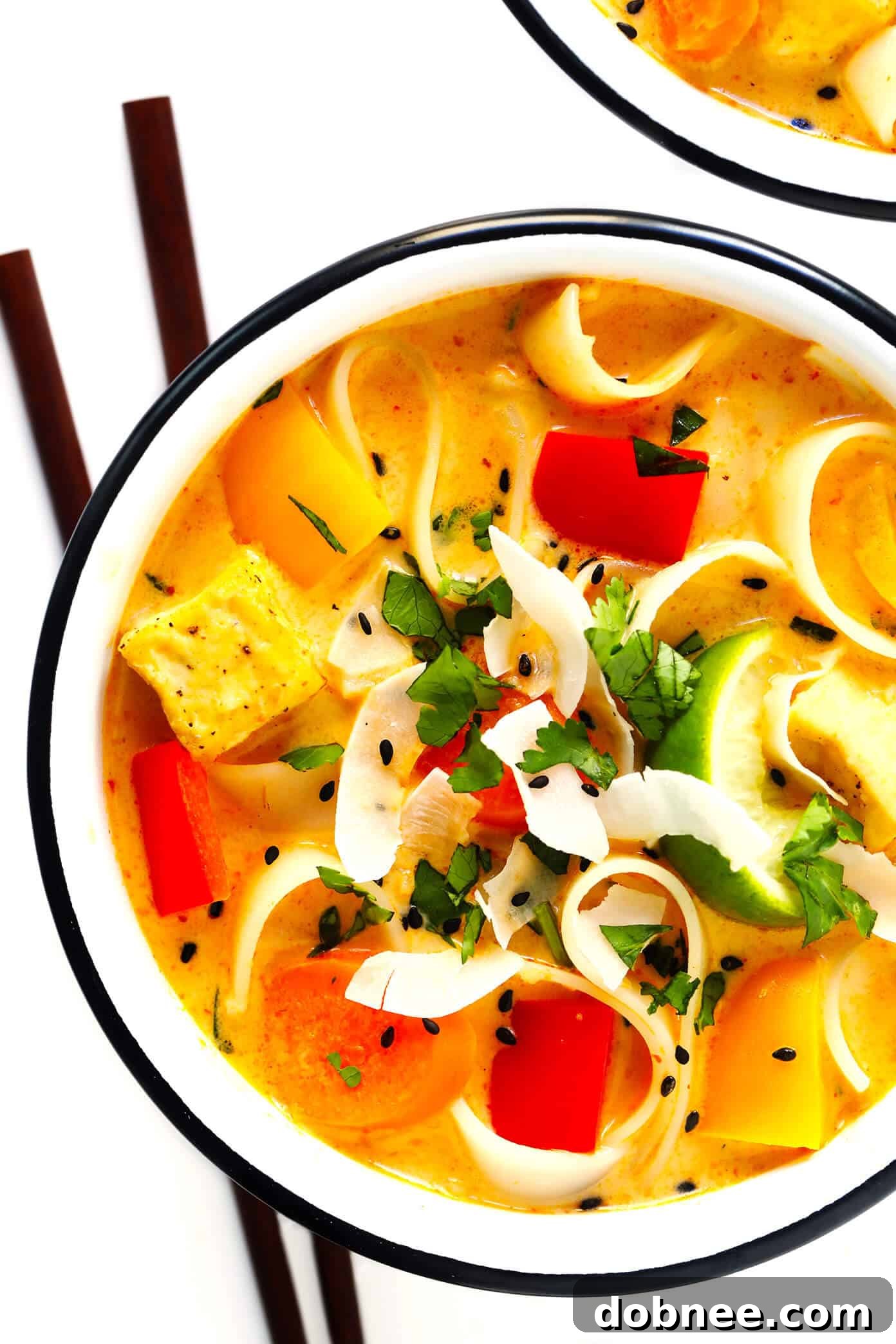 Customizable Thai Red Curry Soup with various toppings