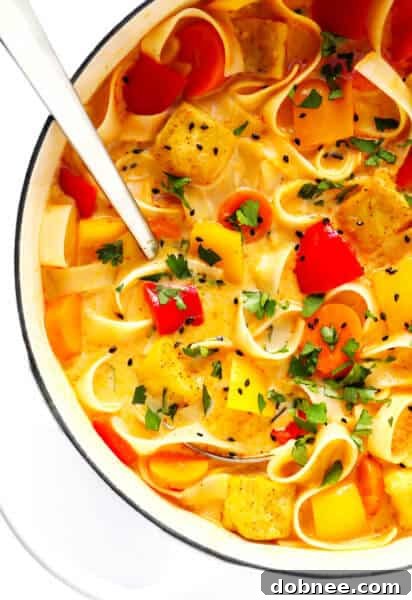 A bowl of delicious Thai Red Curry Soup with fresh ingredients