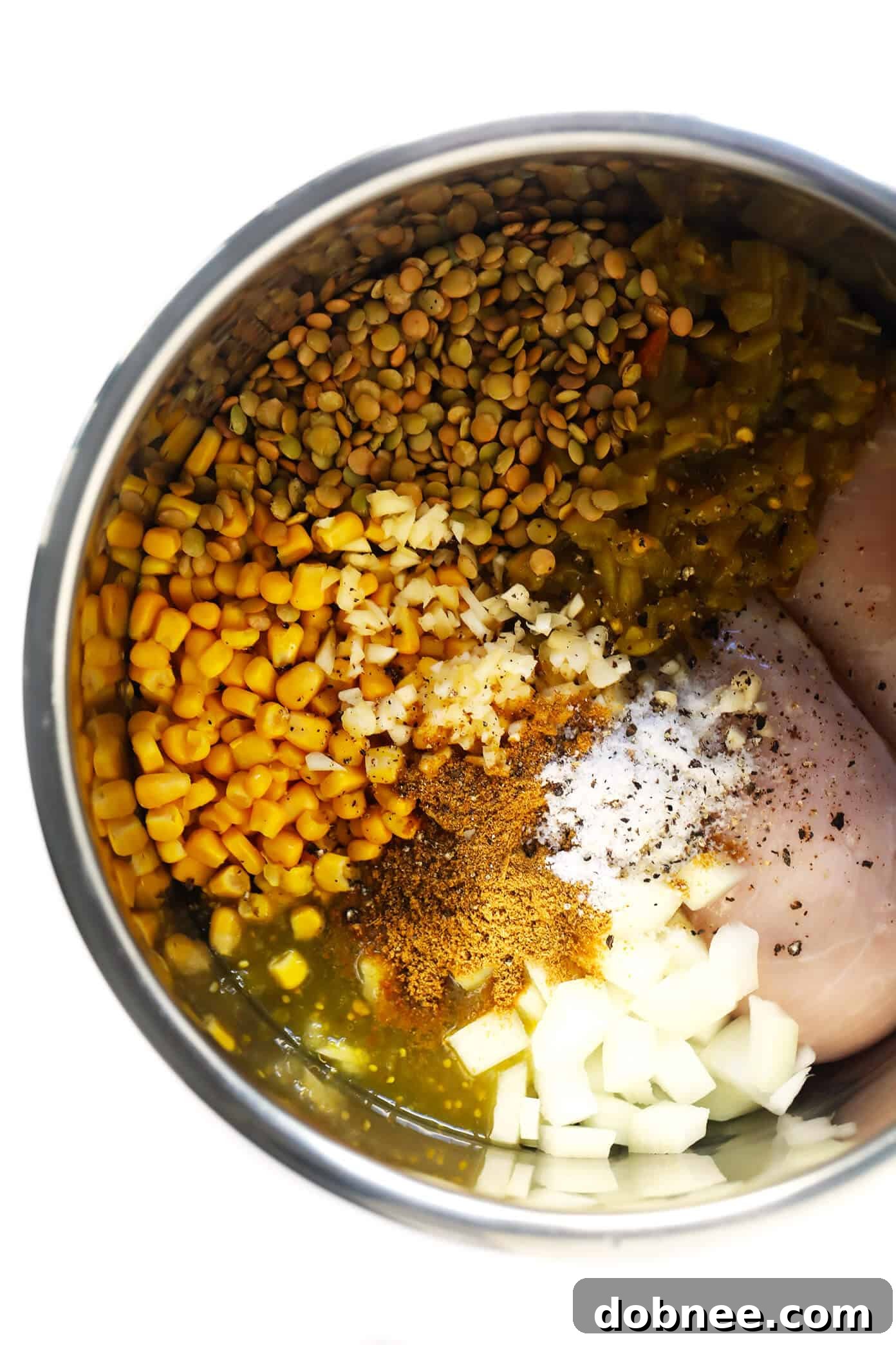 Mexican Chicken Lentil Soup cooking in an Instant Pot, showcasing the rich broth and ingredients.