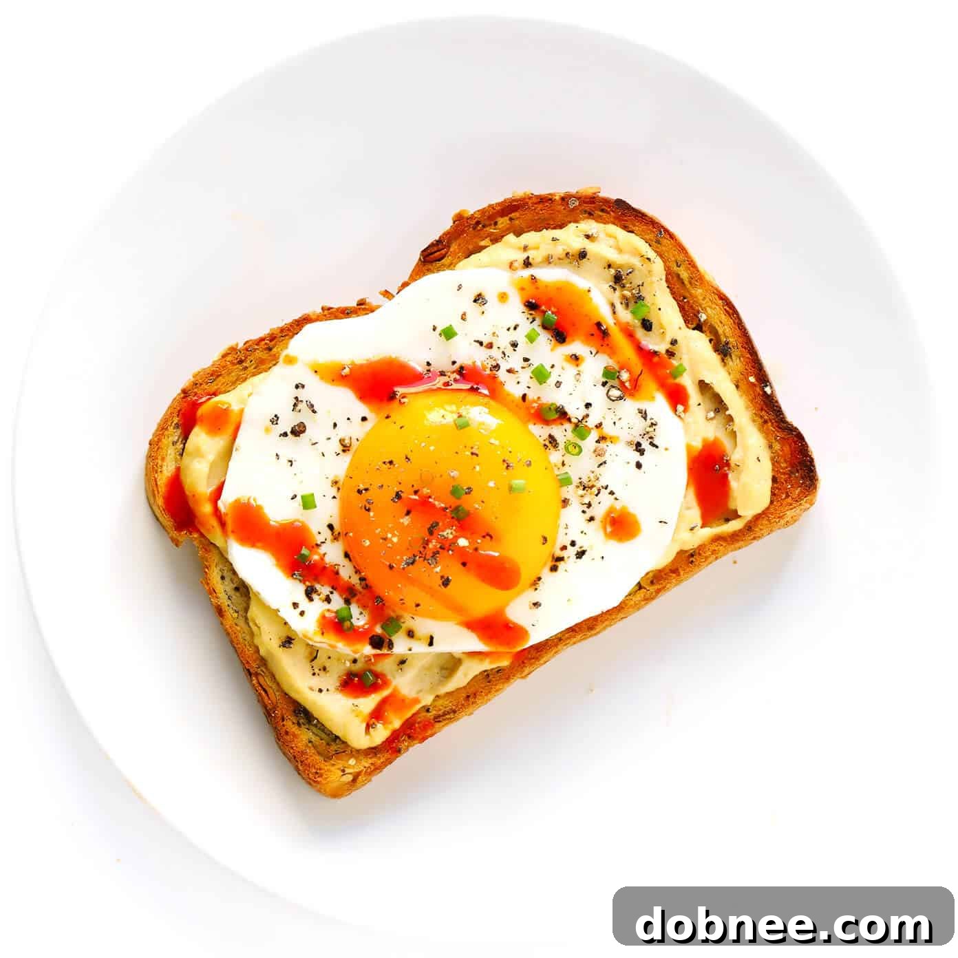 Fried Egg Hummus Toast with Chives
