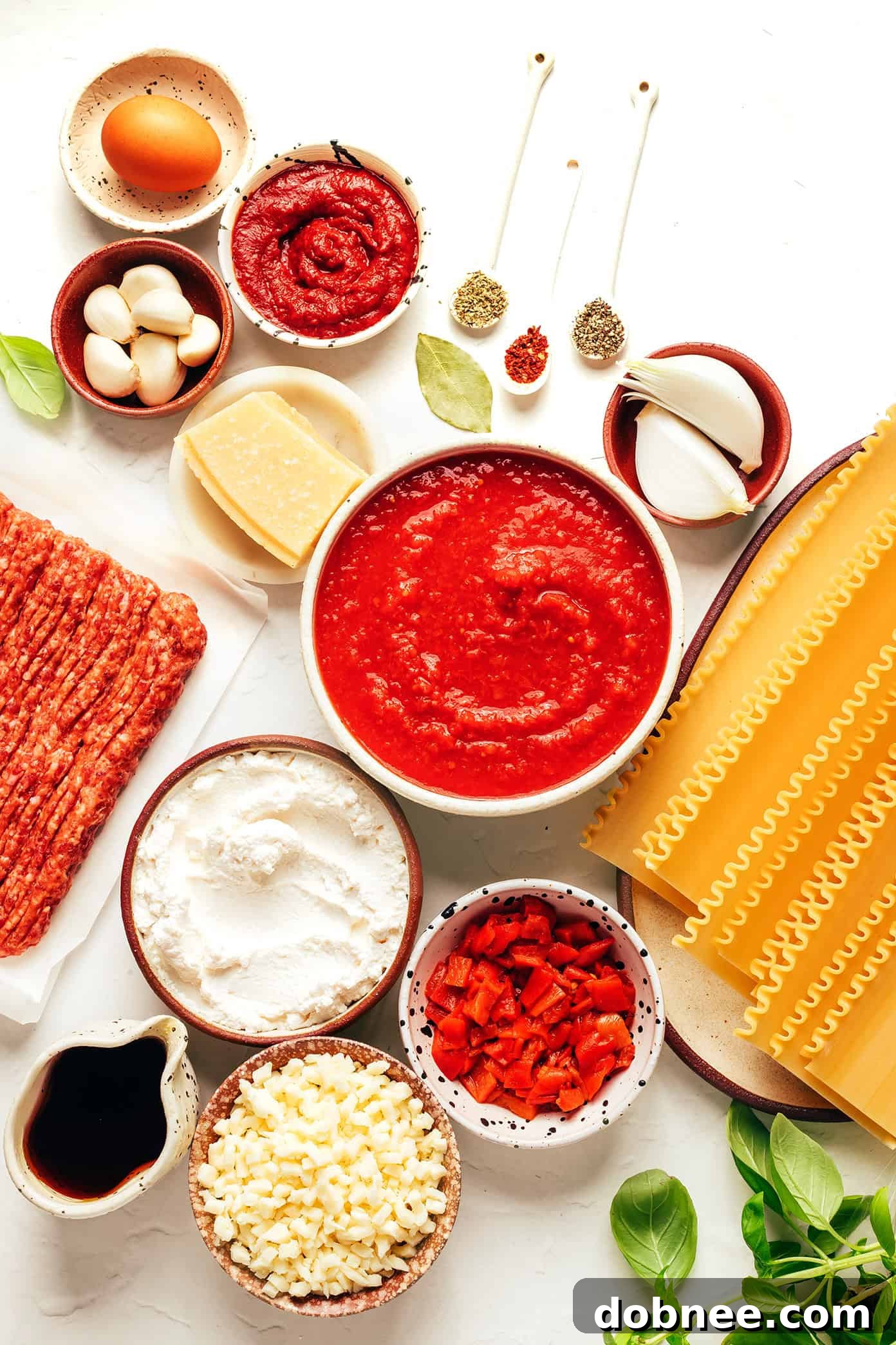 Closeup shot of a baked lasagna, showing the golden-brown cheese and bubbling sauce, ready to be served.
