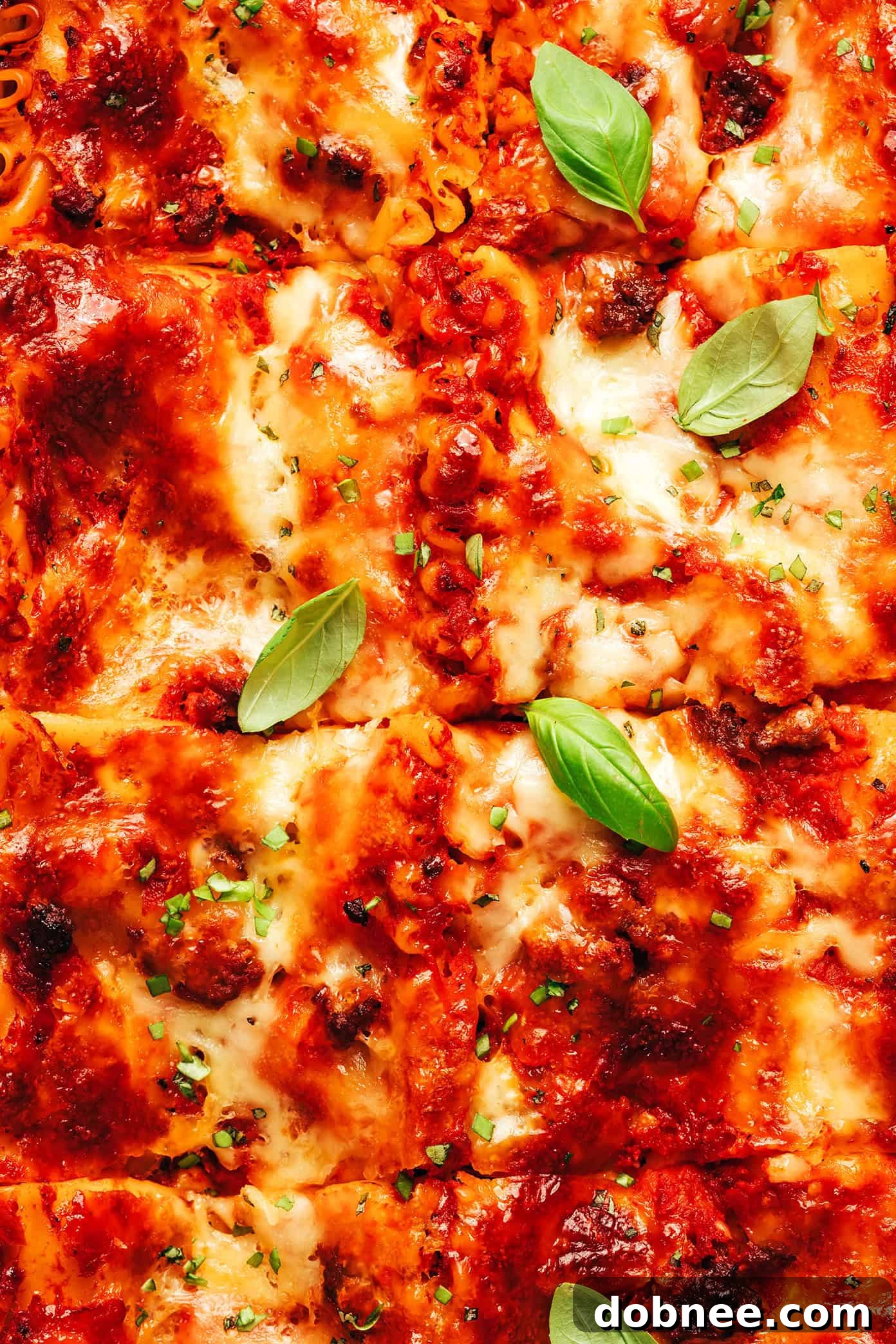 A slice of perfect lasagna being lifted from the pan, showcasing its distinct, delicious layers.