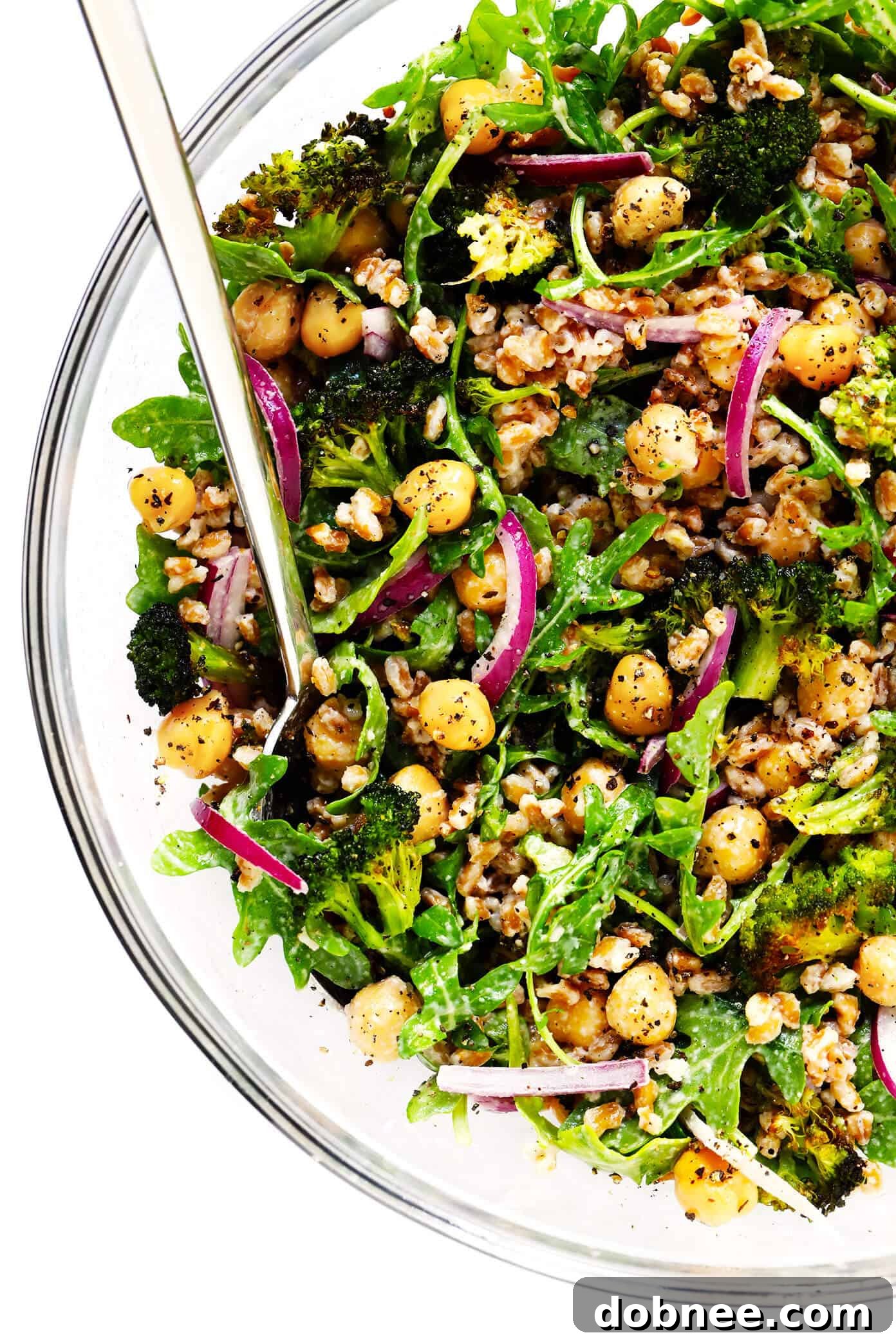Roasted Broccoli and Farro Salad with Chickpeas, dressed in a creamy tahini dressing, showcasing a wholesome and colorful vegan meal perfect for a quick, healthy dinner or lunch.