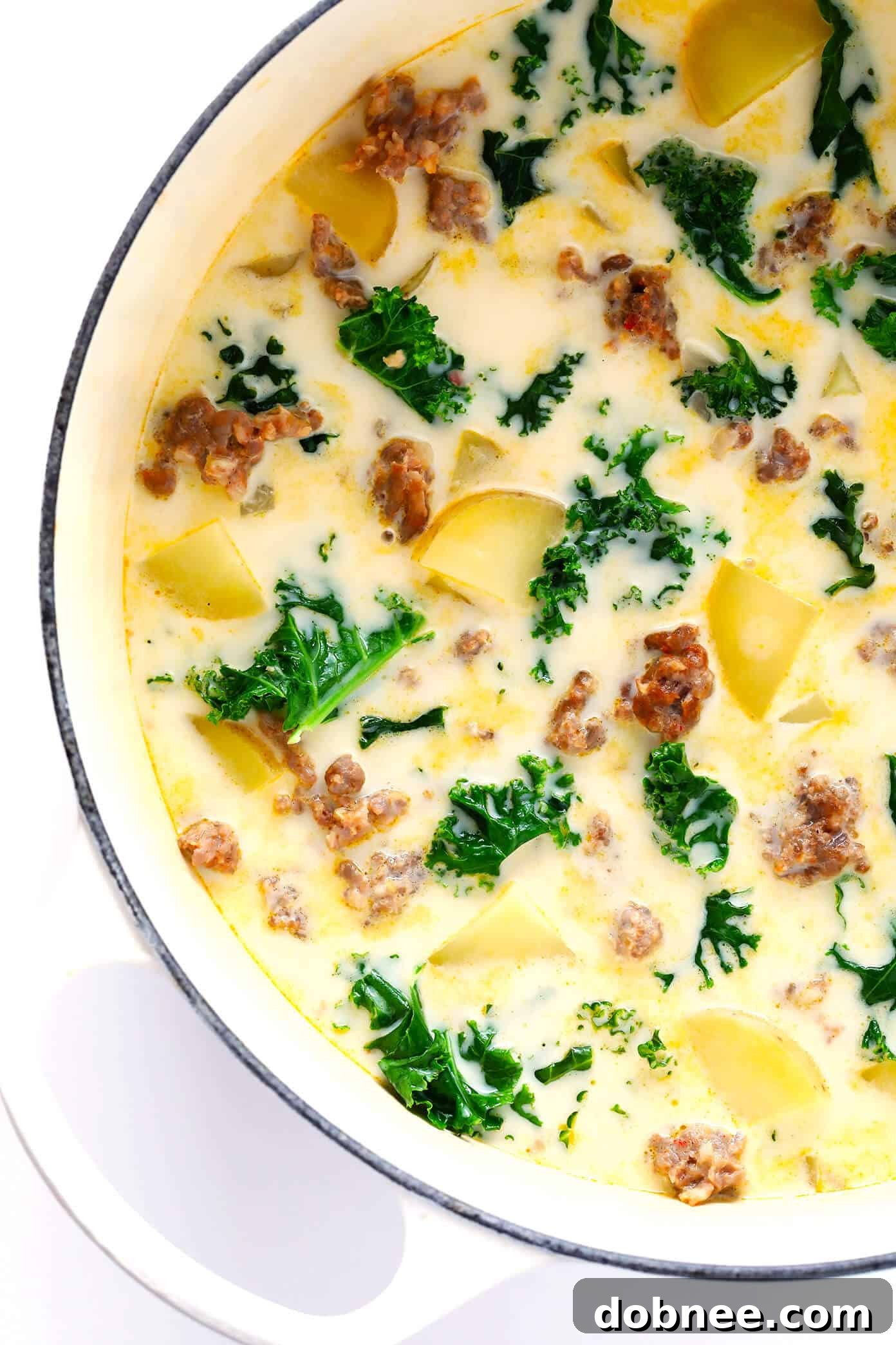 Learn how to make this favorite Olive Garden soup on the stovetop or in the slow cooker! This Zuppa Toscana recipe is super easy to make, naturally gluten-free, and full of the most delicious zesty, creamy flavors. So grab some Italian sausage, kale, potatoes, bacon, Parmesan, and garlic, and make it happen! Crock-pot instructions also included.