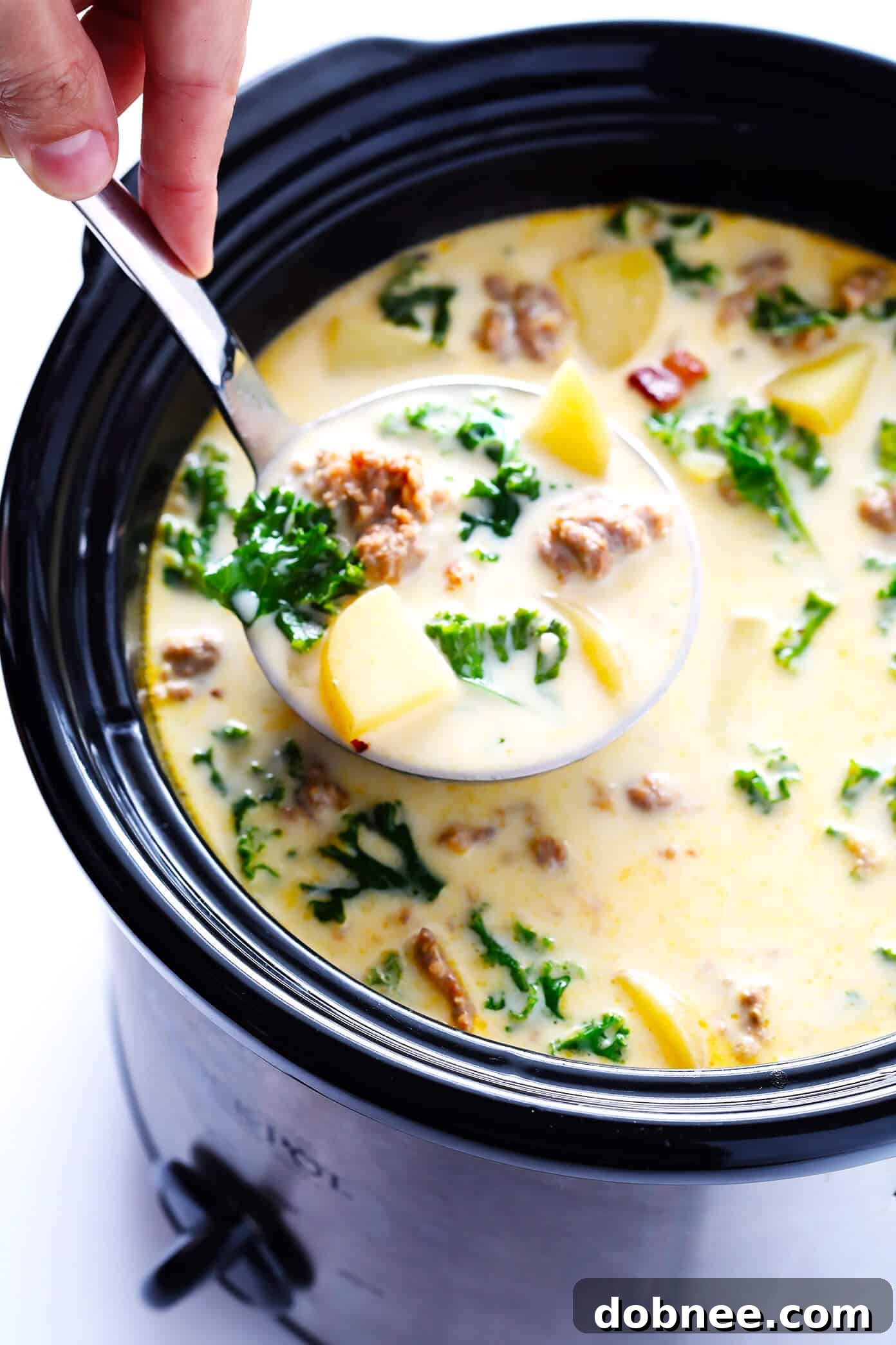 Learn how to make this favorite Olive Garden soup on the stovetop or in the slow cooker! This Zuppa Toscana recipe is super easy to make, naturally gluten-free, and full of the most delicious zesty, creamy flavors. So grab some Italian sausage, kale, potatoes, bacon, Parmesan, and garlic, and make it happen! Crock-pot instructions also included.