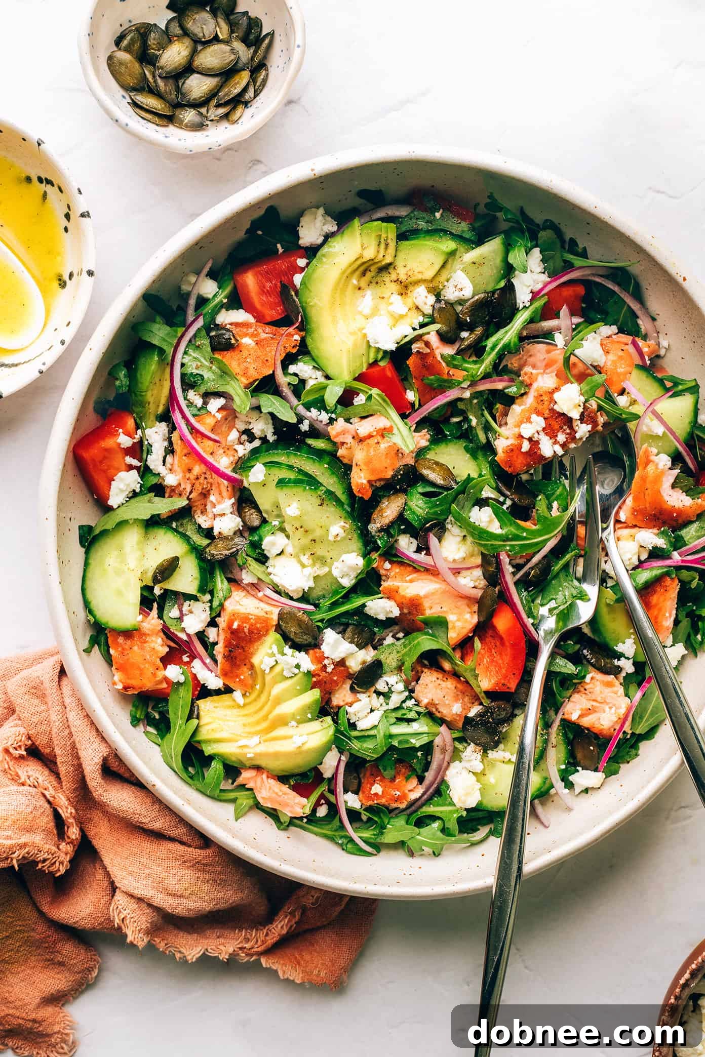 Greek Salmon Salad Bowls on a table