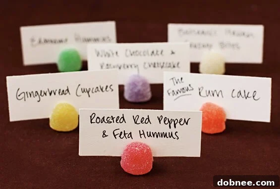 Festive Gumdrop Placeholders Brightly colored gumdrop placeholders arranged on a white tablecloth, ready for a festive gathering. The placeholders are vibrant and inviting, adding a pop of color to the table.