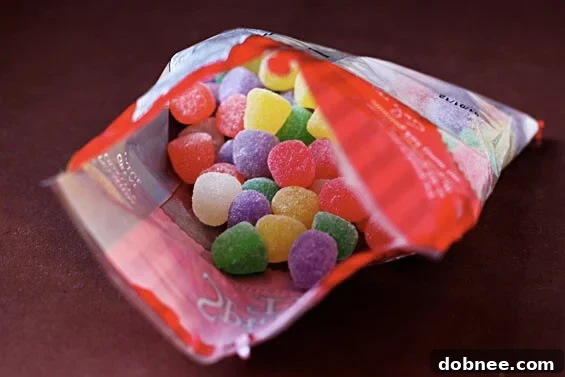 Colorful Gumdrops for Crafts Close-up of vibrant gumdrops in various colors, including red, green, yellow, and orange, neatly arranged and ready to be transformed into unique place card holders.