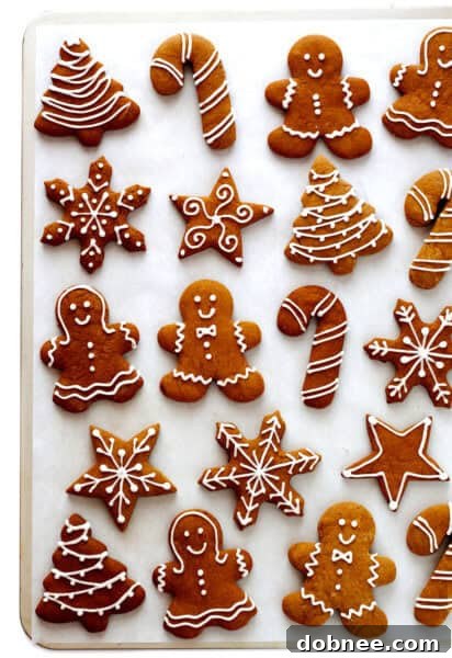 Classic cut-out gingerbread cookies, beautifully decorated for the holidays.