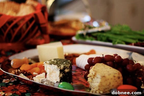 A beautifully arranged spread of appetizers, prepared by the hosts Kathy and Roxanne, offering a delicious savory complement to the sweet cookies at the KC Food Bloggers' Cookie Exchange.