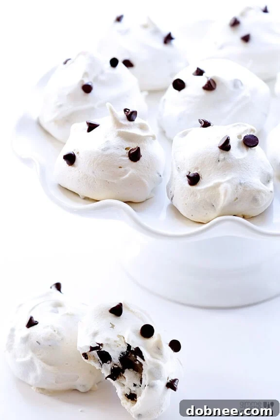 A final close-up of a single chocolate chip meringue cookie, perfectly golden with visible chocolate chips, ready to be enjoyed.