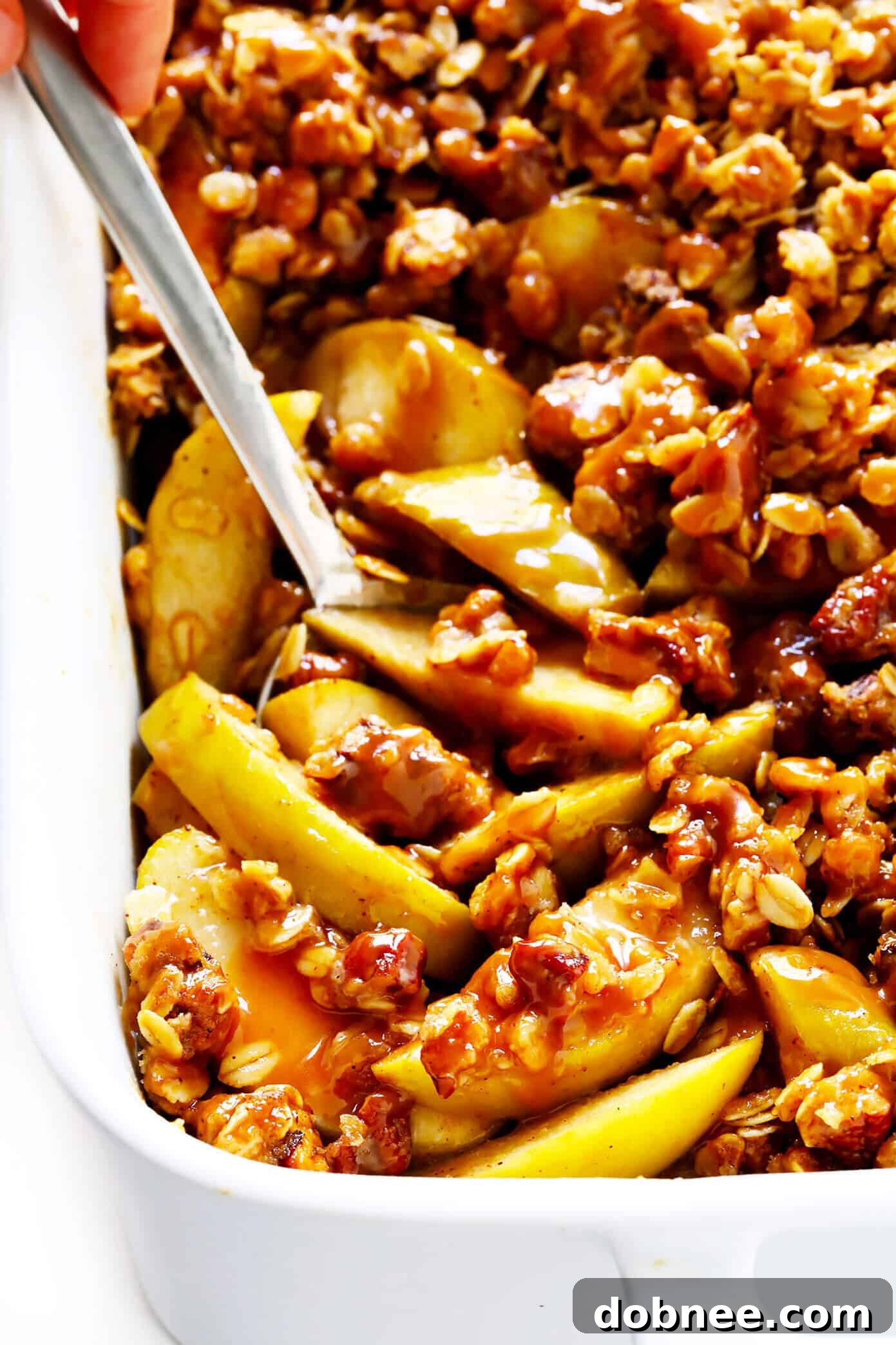 A close-up of the baked apple crisp with a golden, textured topping.