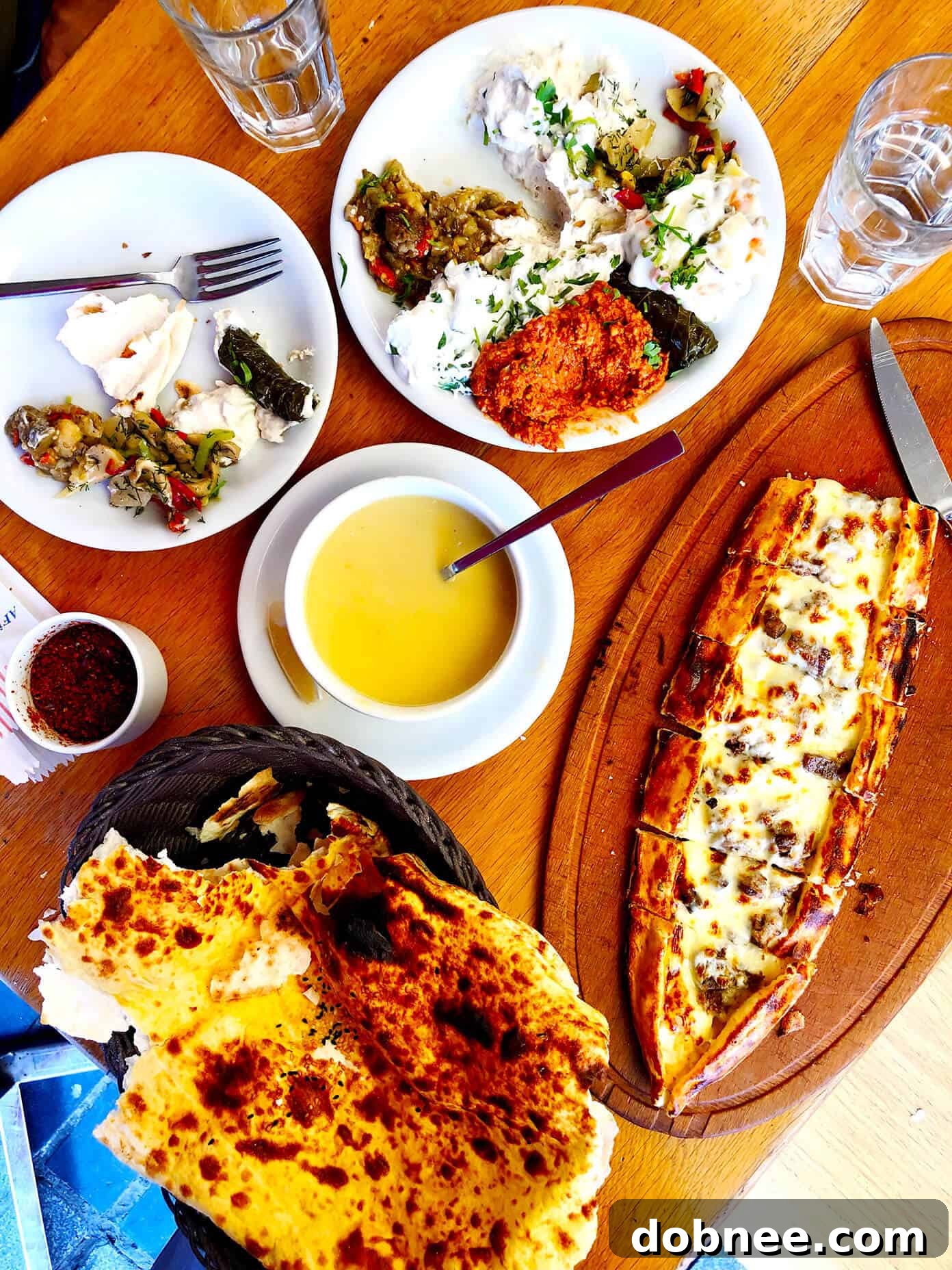 Istanbul Turkish Food spread including lentil soup, lavash, and pide