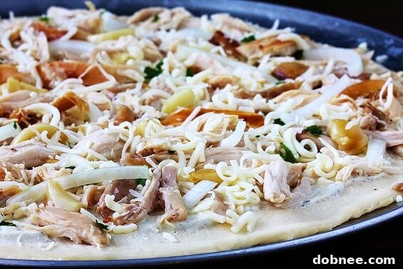 Close-up of baked Roasted Garlic Chicken Pizza slice